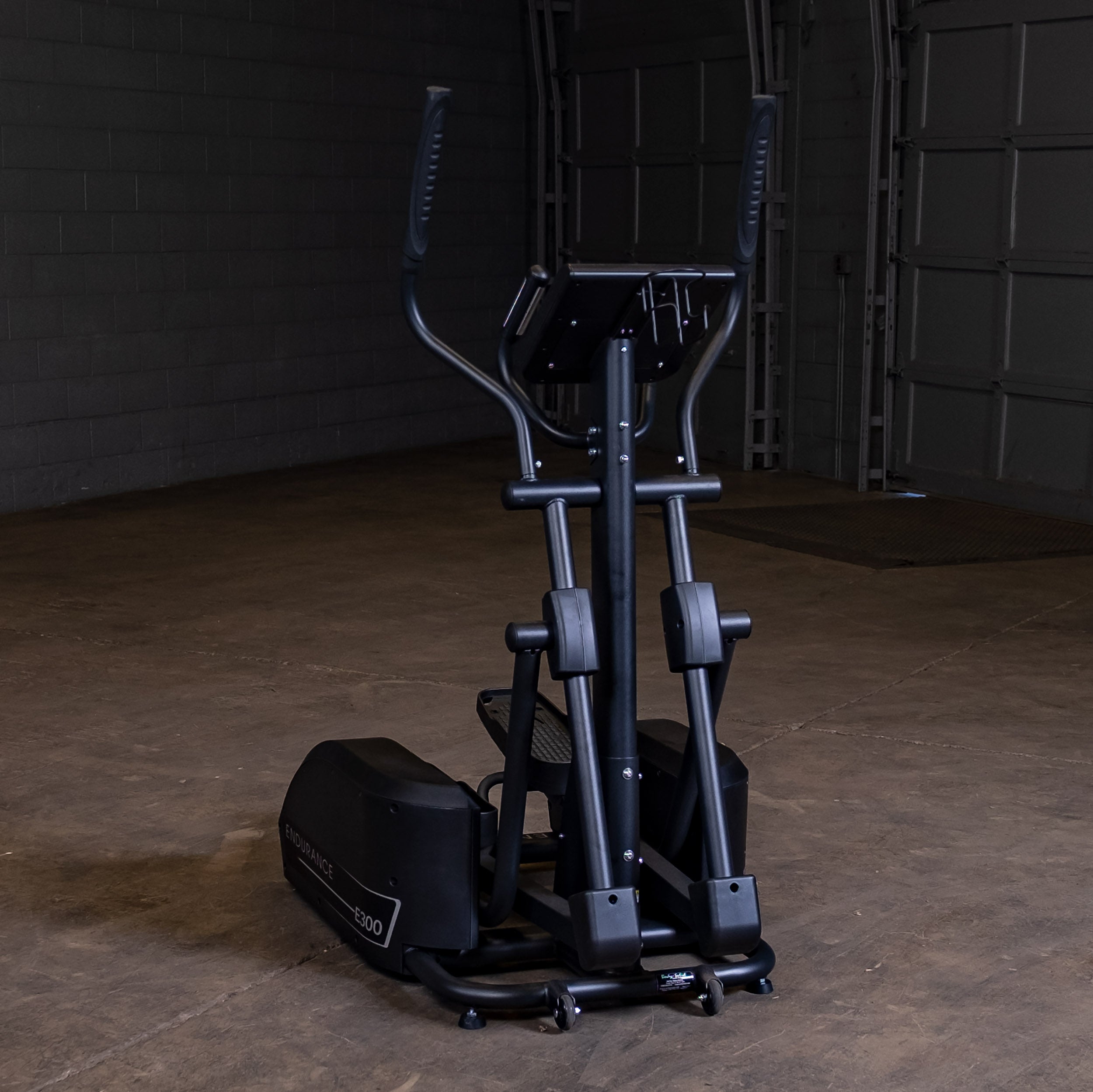 Rear view of Body-Solid Endurance E300 elliptical trainer showing frame design and compact footprint