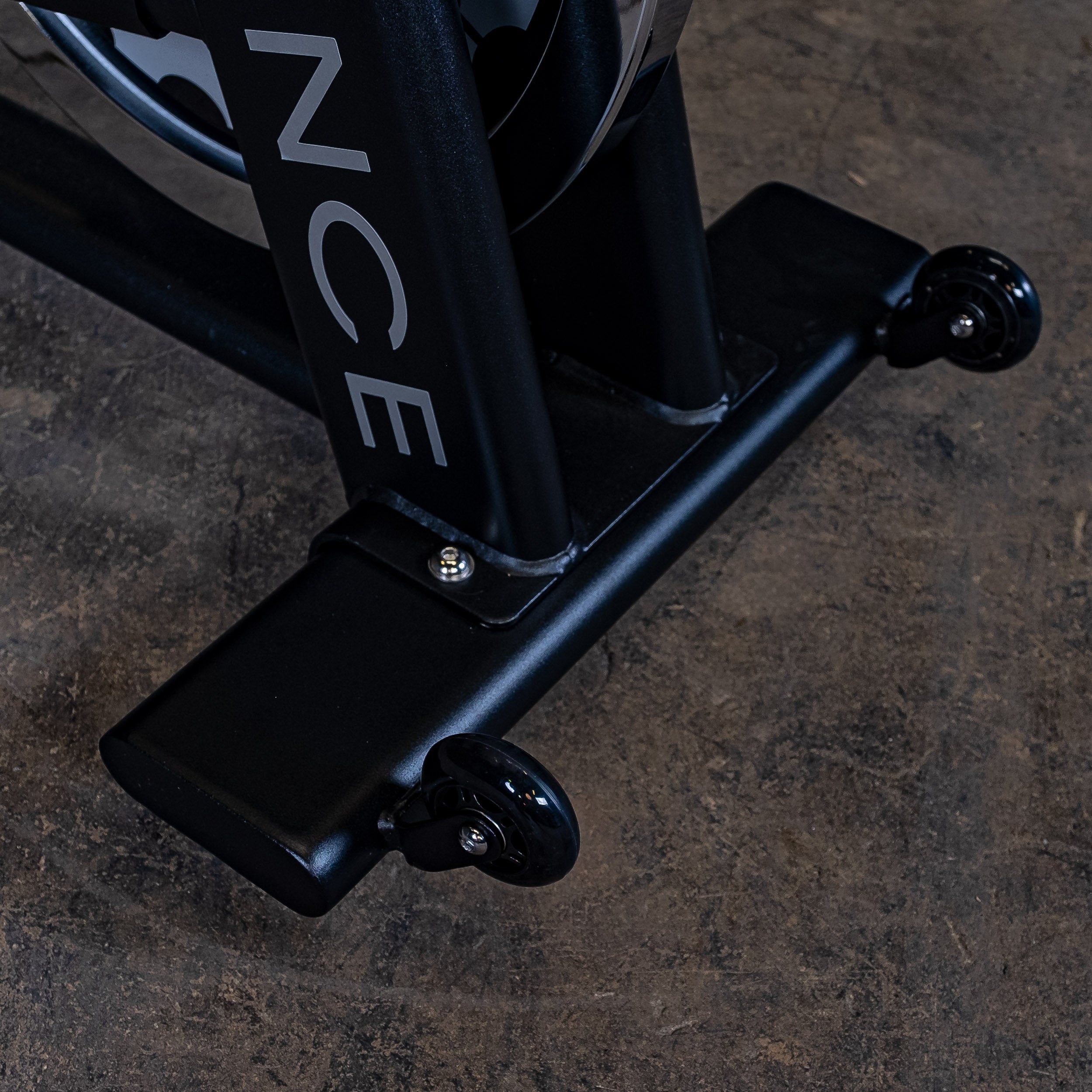 Close-up of the Body-Solid Endurance ESB250 indoor training cycle transport wheels for easy movement and positioning