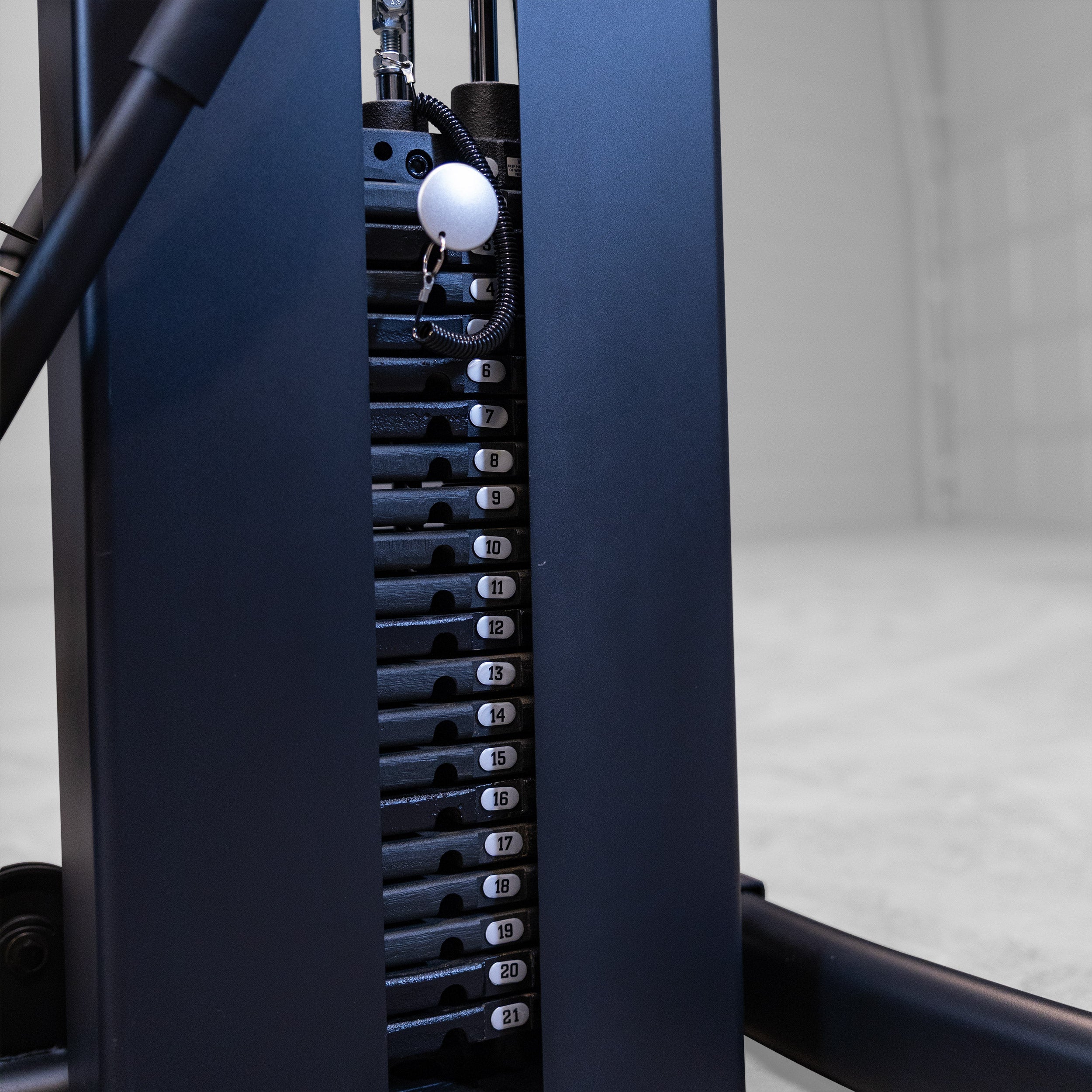 Close-up of the Body-Solid Fusion 600B selectorized weight stack with magnetic weight selector pin