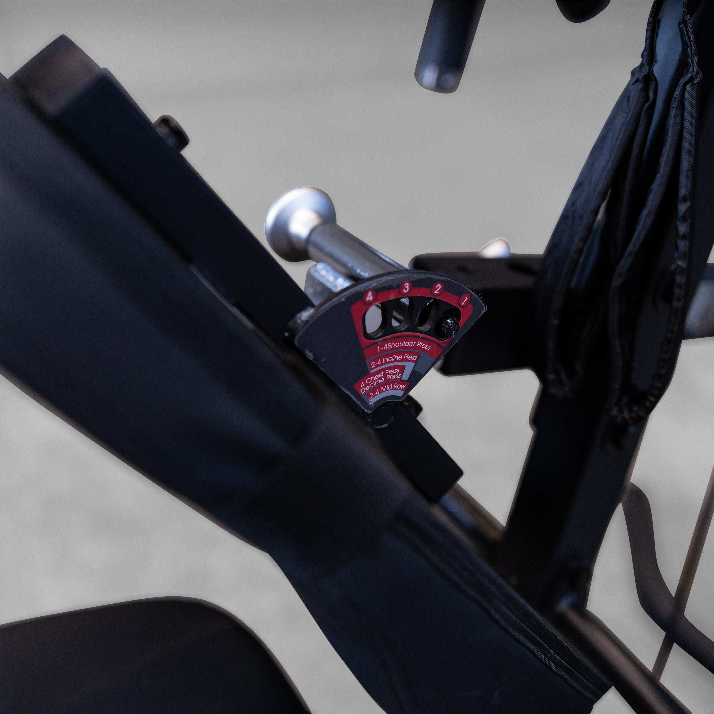 Close up of the adjustable press arm settings on the Body-Solid G3B multi station home gym for chest incline shoulder press and mid row exercises