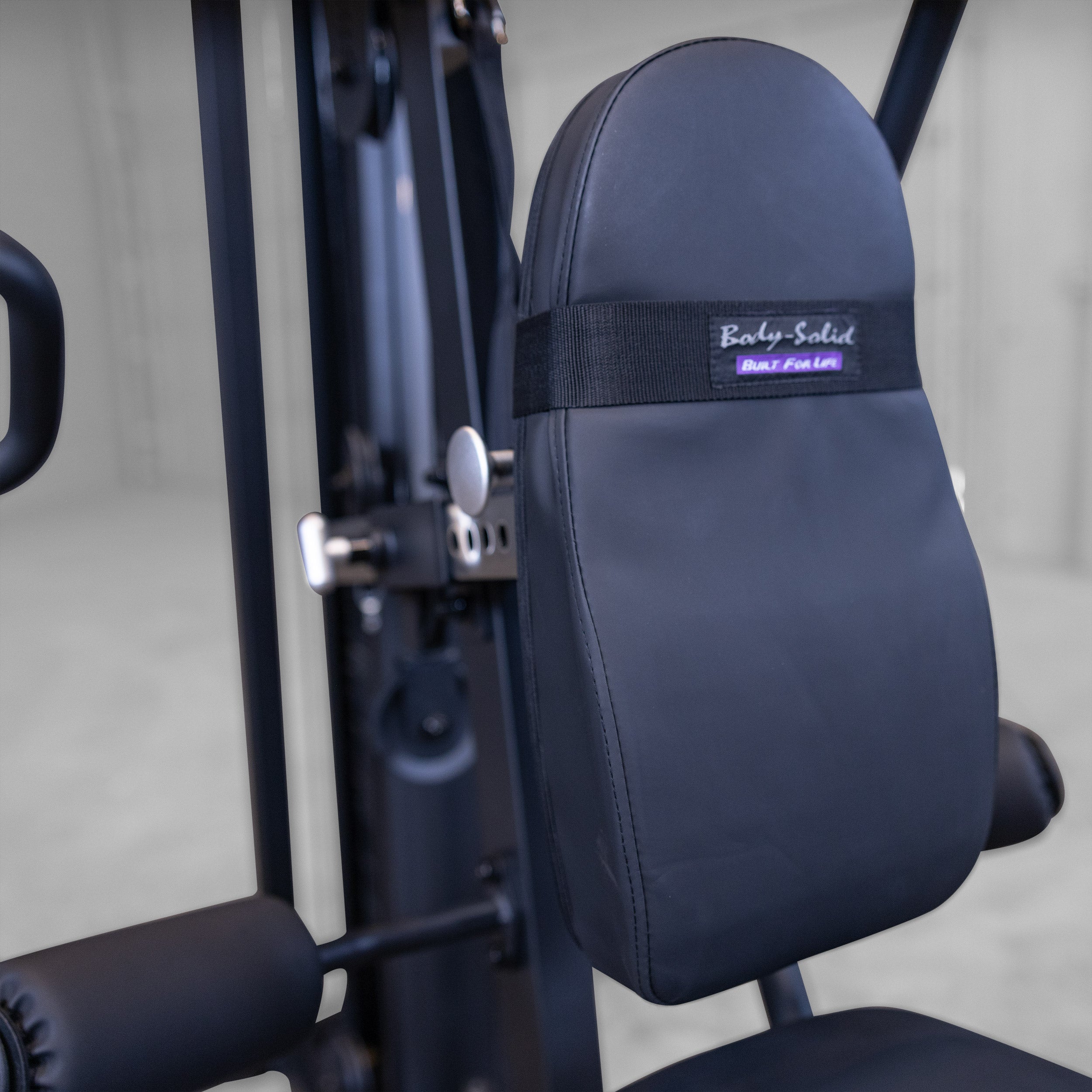 Close up of the adjustable back pad on the Body-Solid G5B multi station home gym with multiple height adjustment positions for customized workout support