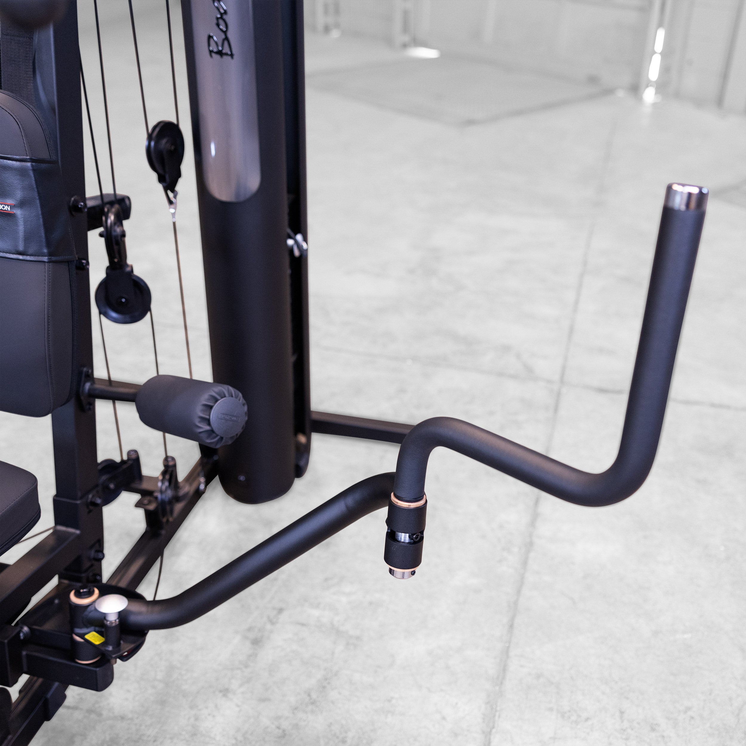 Close up of the Body-Solid G6B patented Bi-Angular press arm with ergonomic multi grip handle