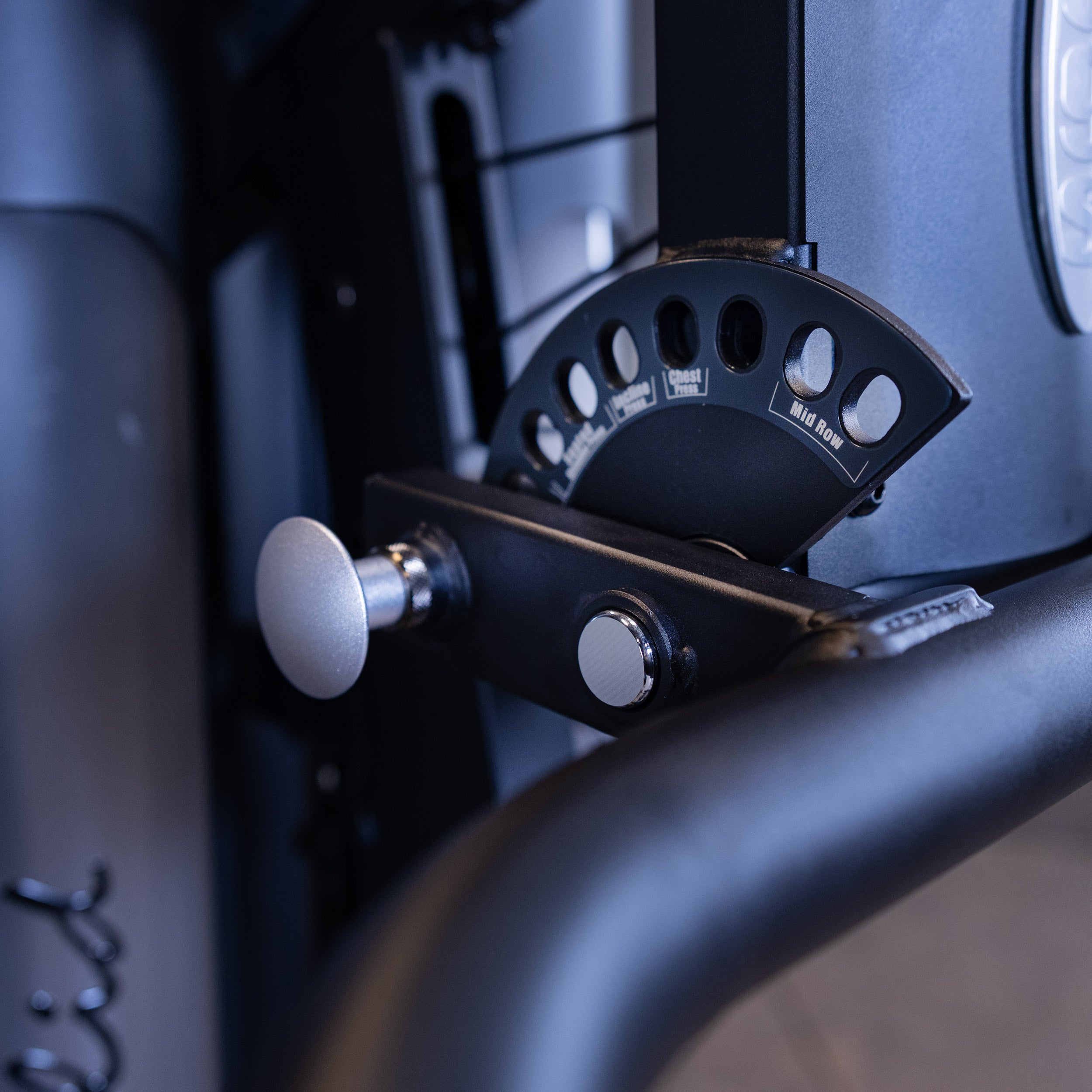 Close up of the Body-Solid G9B multi grip press arm adjustment selector for chest press and mid row exercises