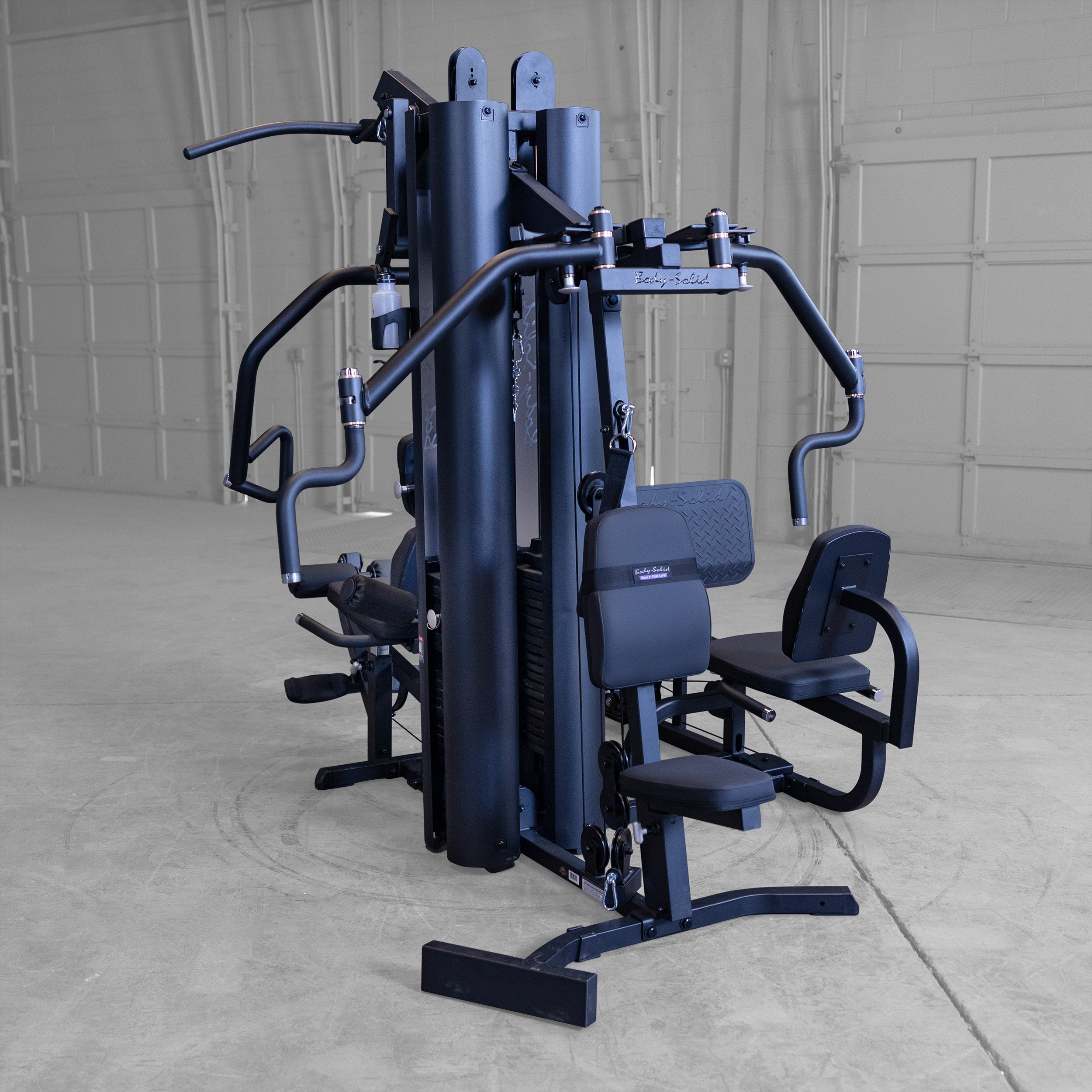 Rear view of the Body-Solid G9B dual stack multi station home gym with integrated leg press and dual 210 lb weight stacks