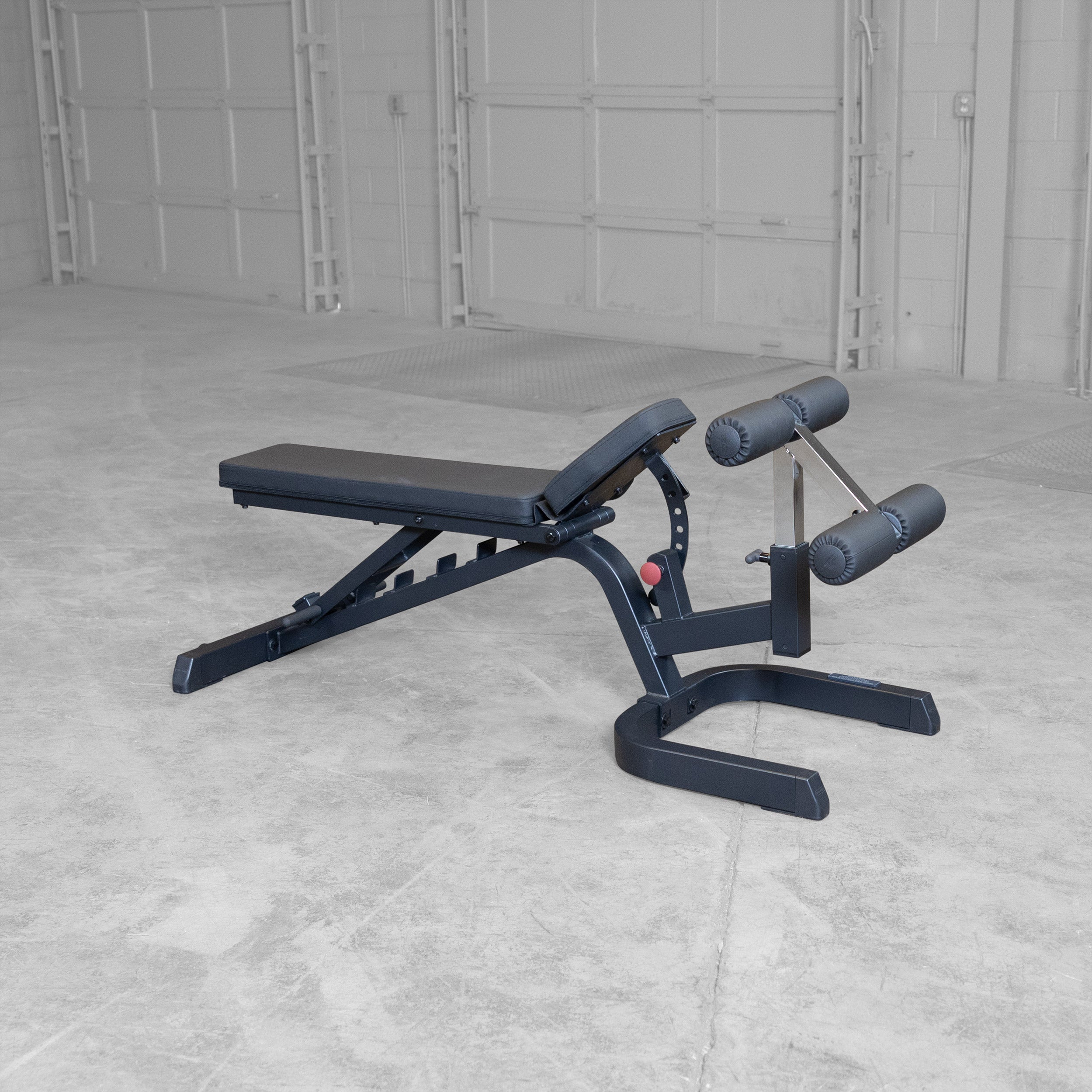 Body-Solid GFID71B Heavy Duty Flat Incline Decline Bench shown with the seat pad adjusted to a mid incline position to provide proper support during incline pressing exercises