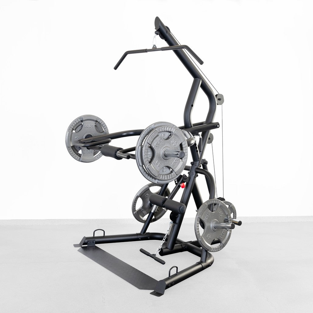 Body-Solid GLGS100B Corner Leverage Gym loaded with Olympic weight plates in a home gym setting
