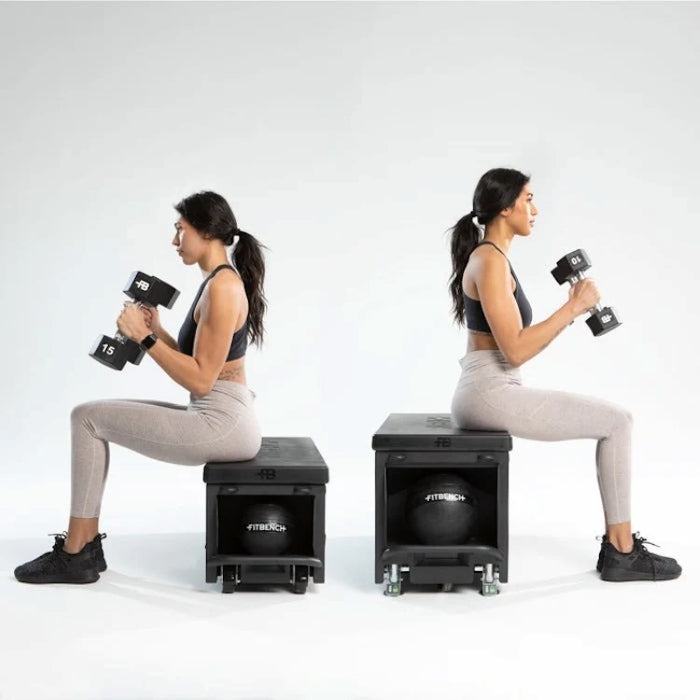 Woman performing seated dumbbell curls on FITBENCH Studio workout bench