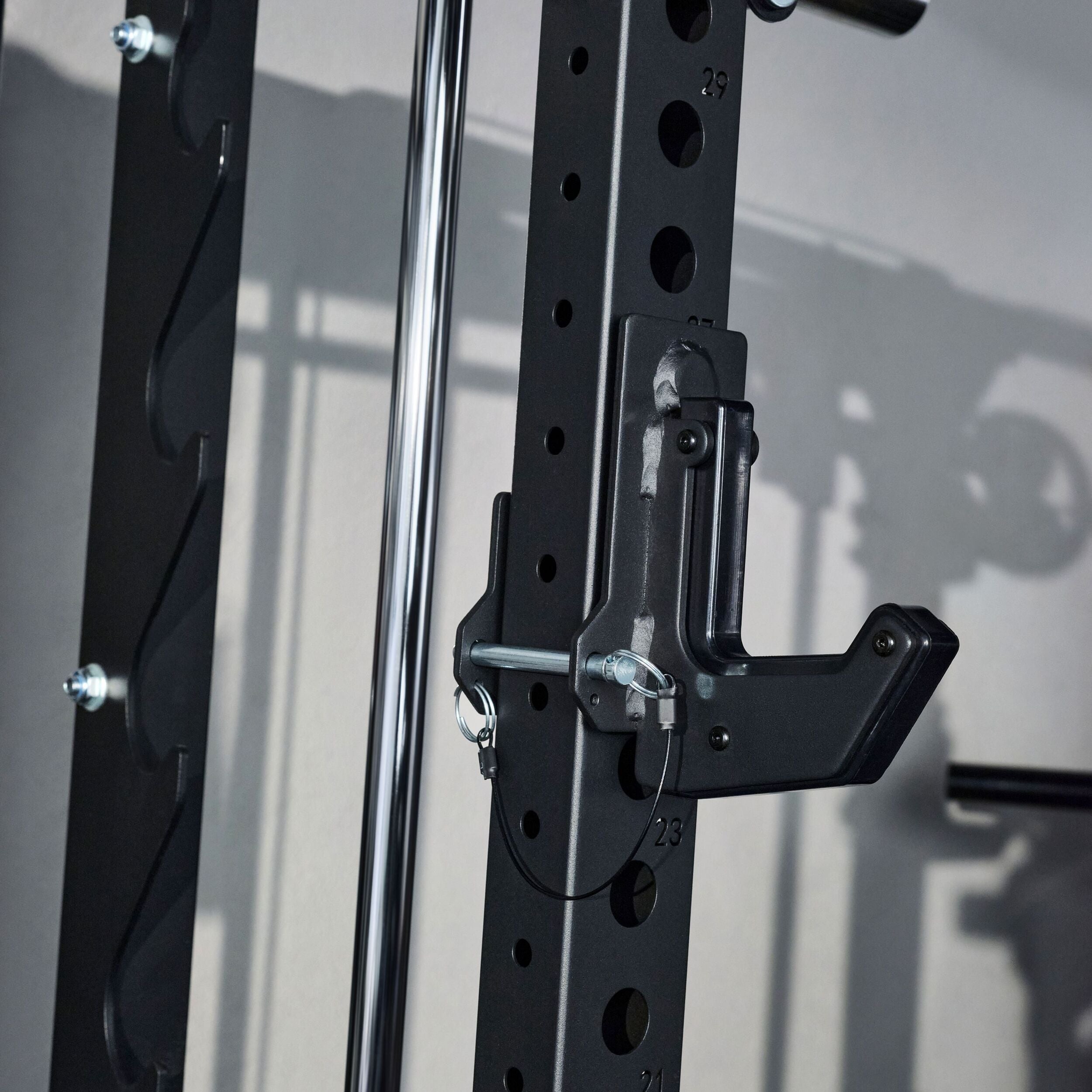 Close up of the adjustable J hook and smith machine rail system on the Major Fitness B52 Pro home gym