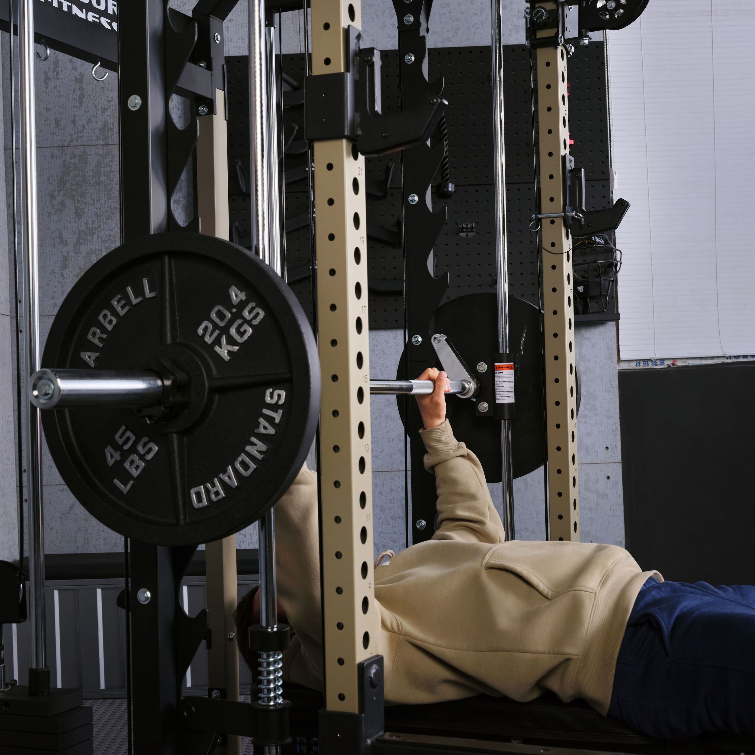 Athlete performing bench press exercise on the Major Fitness B52 Pro all in one smith machine home gym