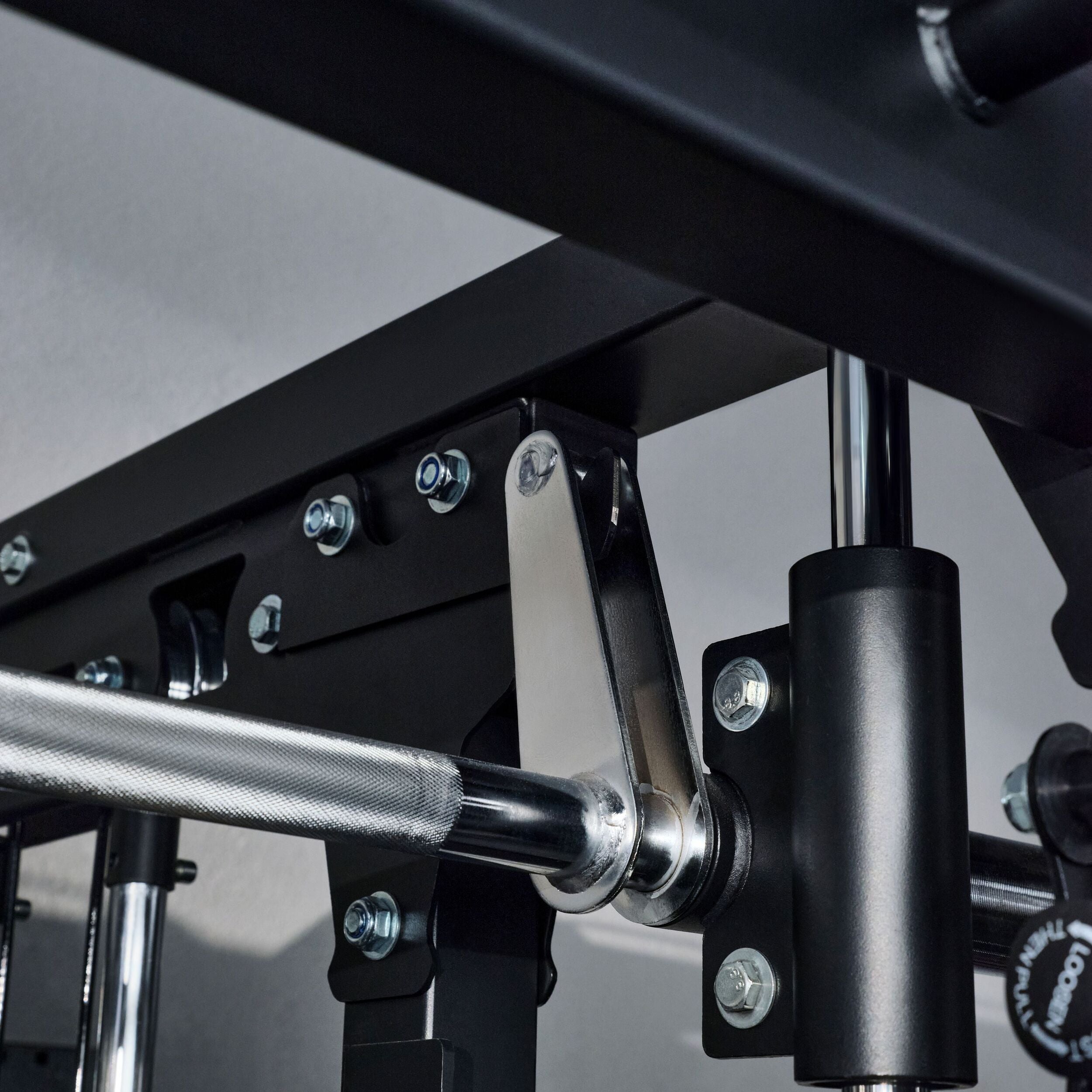 Close up of the linear bearing smith machine bar system on the Major Fitness B52 Pro home gym