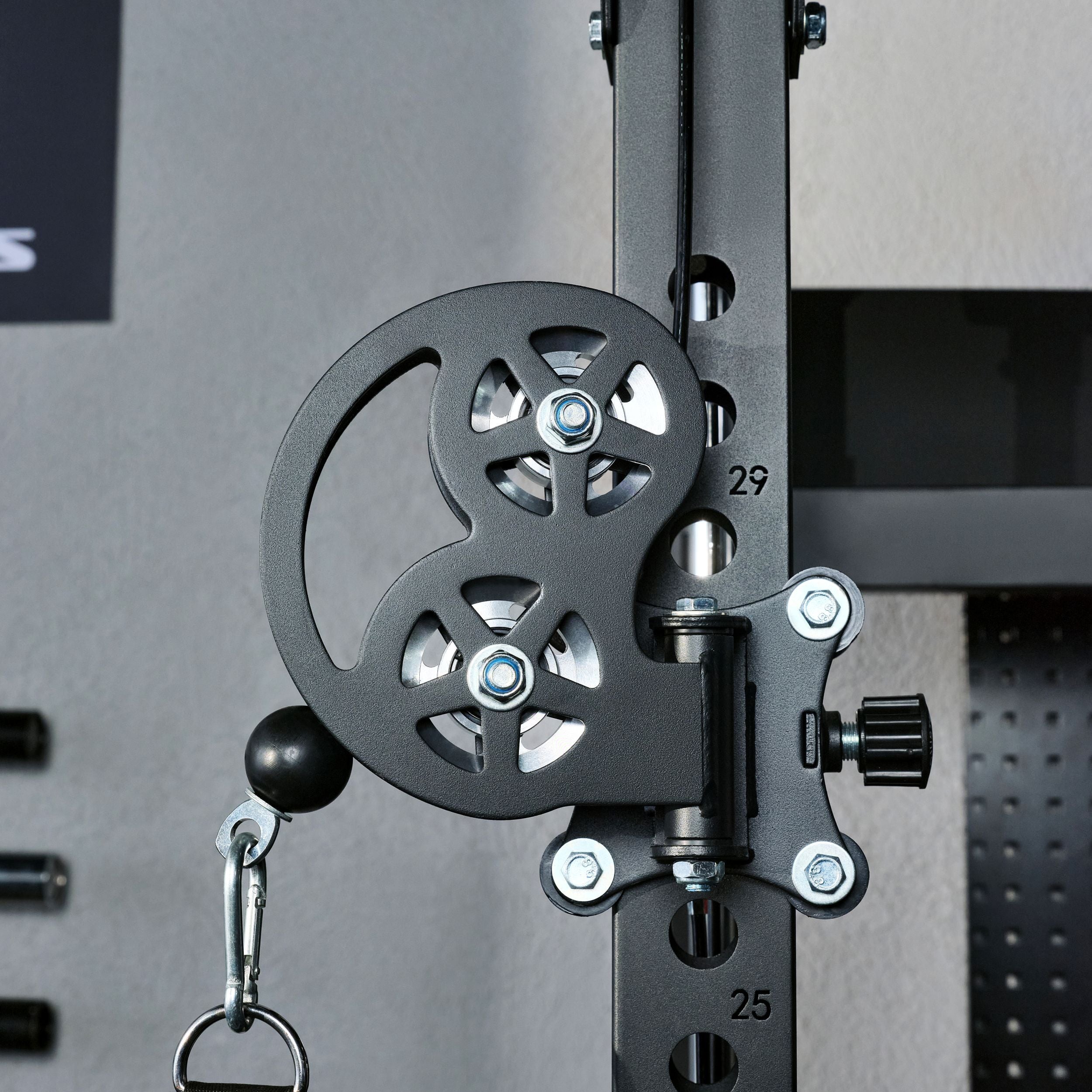 Close-up of the adjustable dual pulley system on the Major Fitness F22 Pro power rack featuring smooth cable operation and multiple height adjustment positions