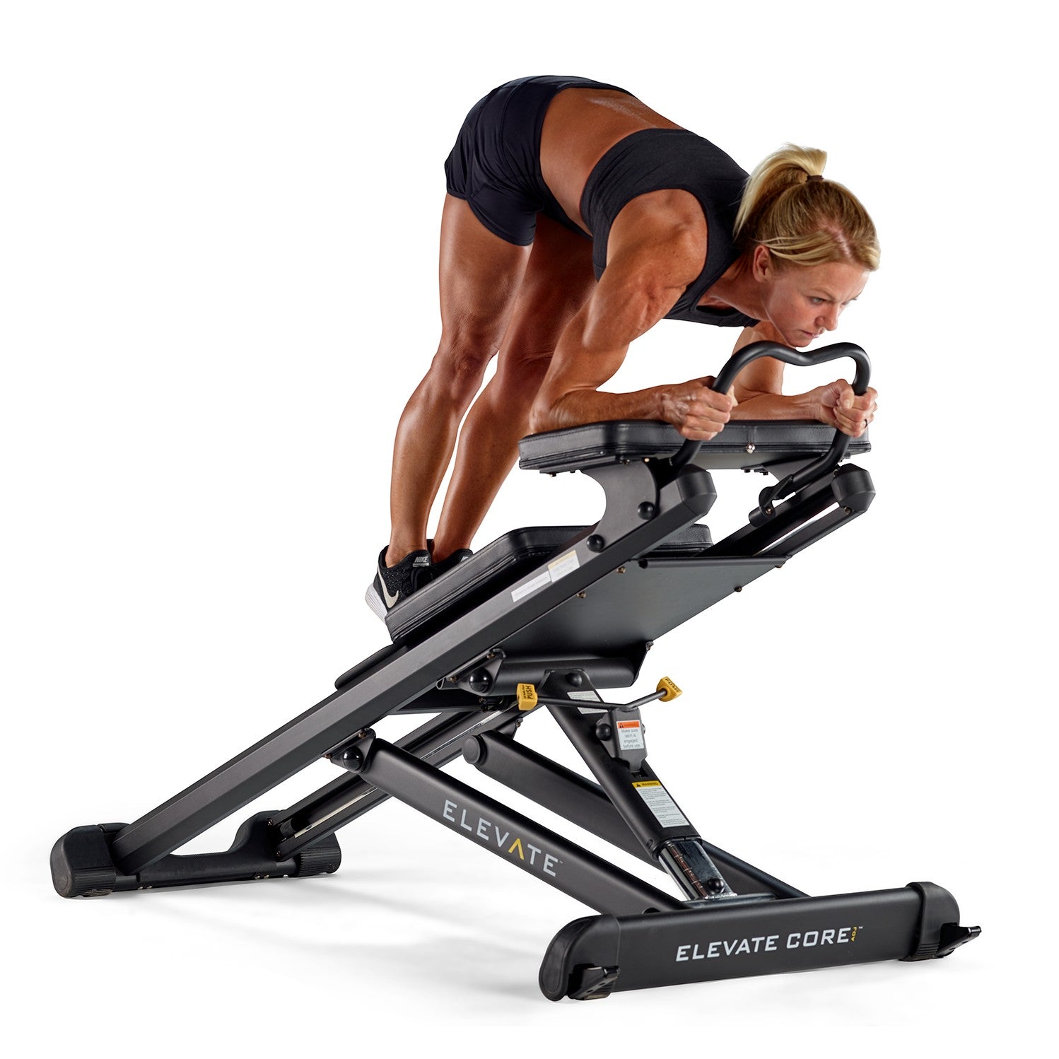 Person performing a pike exercise on the Total Gym ELEVATE Core ADJ Adjustable Core Trainer to strengthen the core and improve stability