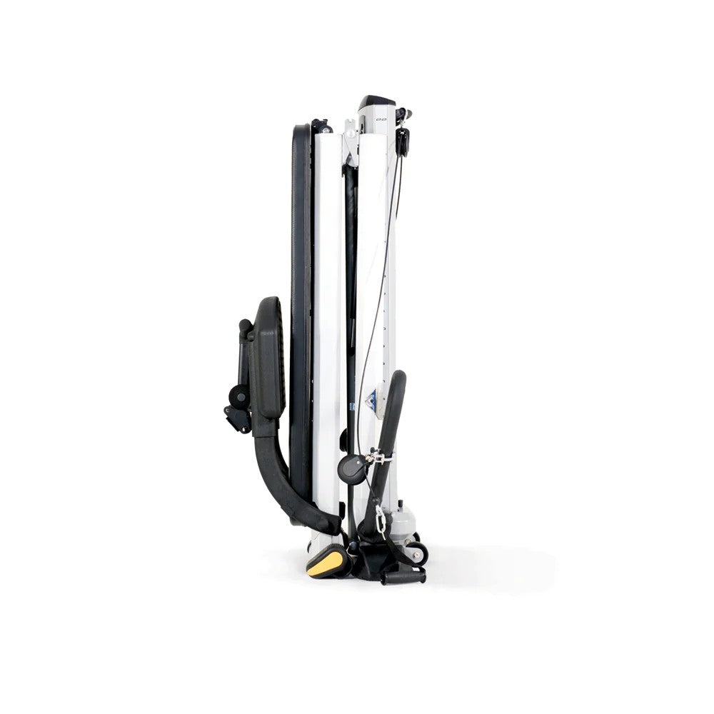 Total Gym GTS folded upright for compact storage with transport wheels for easy mobility
