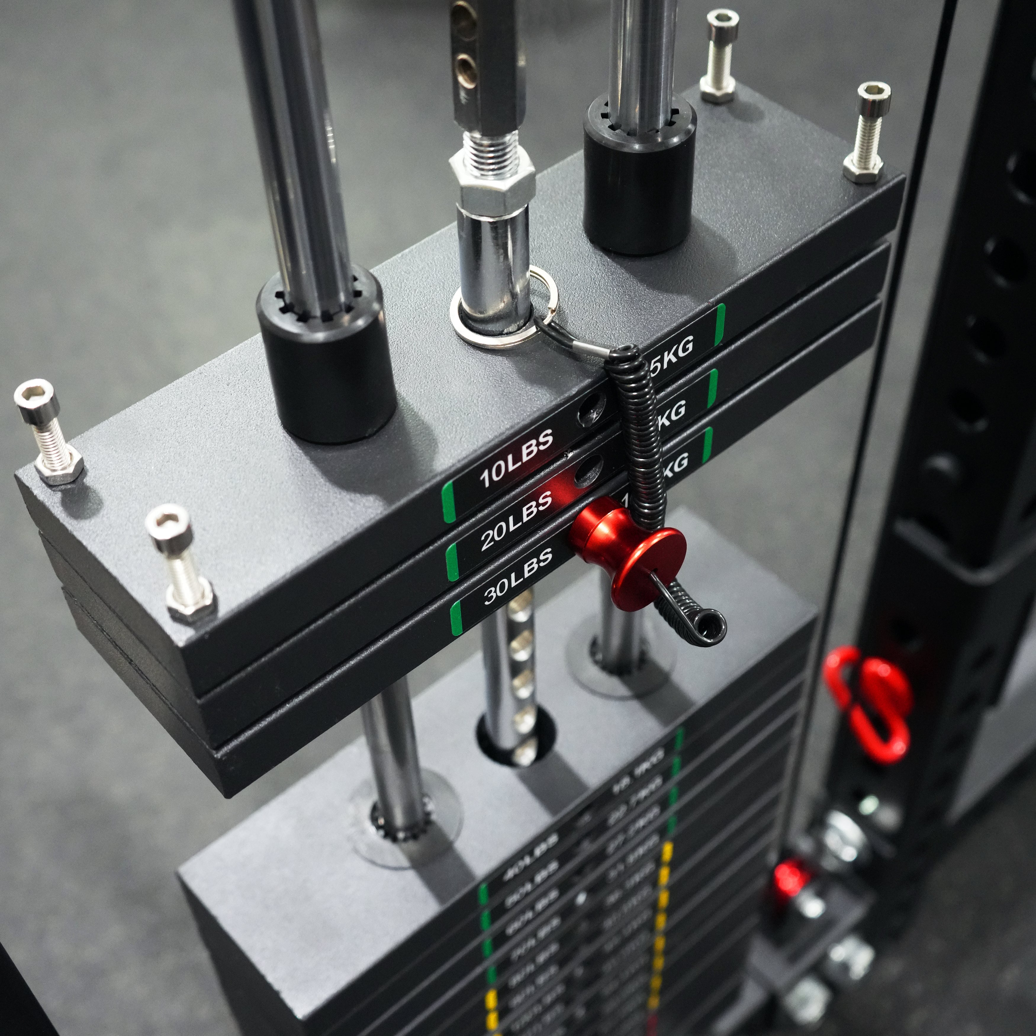 Close up view of the Valor Fitness BD-83 functional trainer dual weight stack with magnetic selector pin and laser etched weight markings