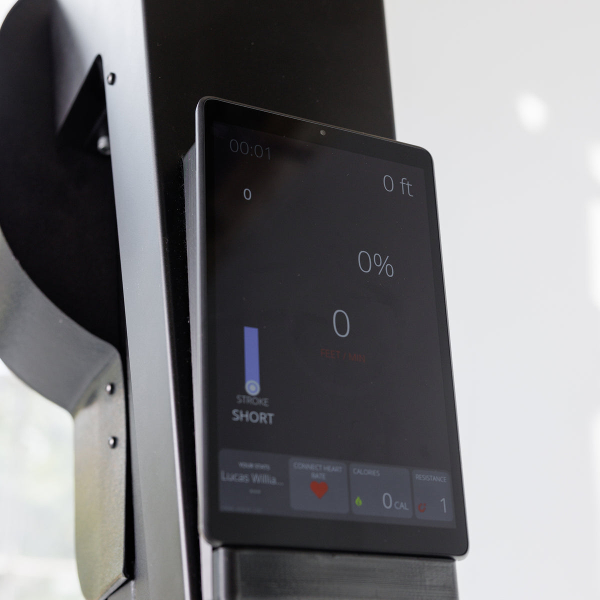 Close-up of VersaClimber TS-Magnetic touchscreen display showing workout metrics, climbing speed, calories and resistance level
