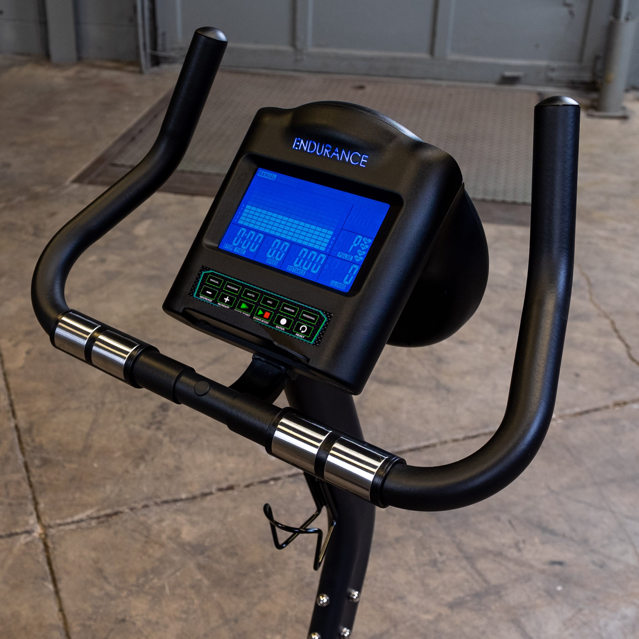 Body-Solid Endurance B4UB upright exercise bike console display with workout metrics and control buttons
