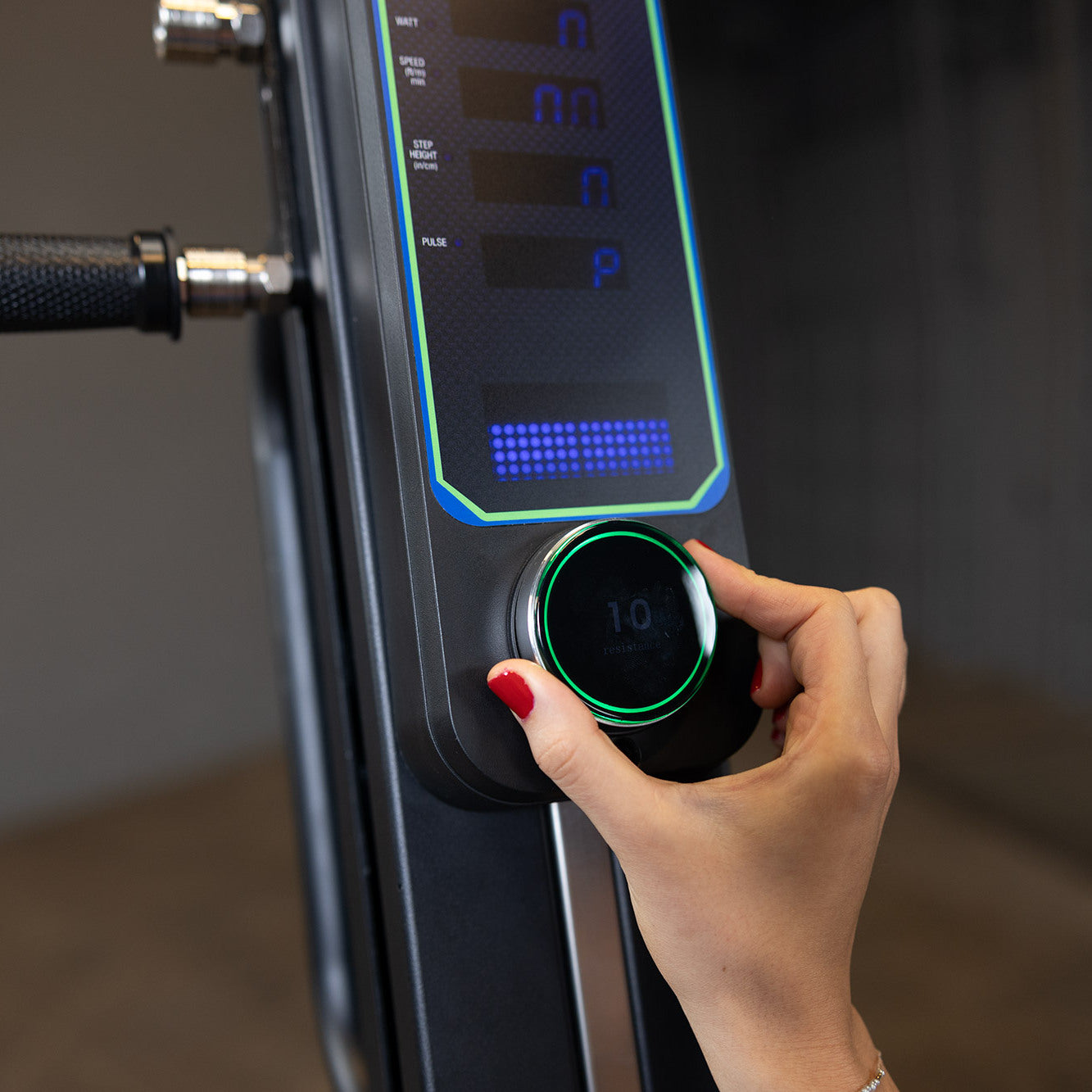 Close-up of Body-Solid Endurance CL300 vertical climber console showing resistance control knob and display panel