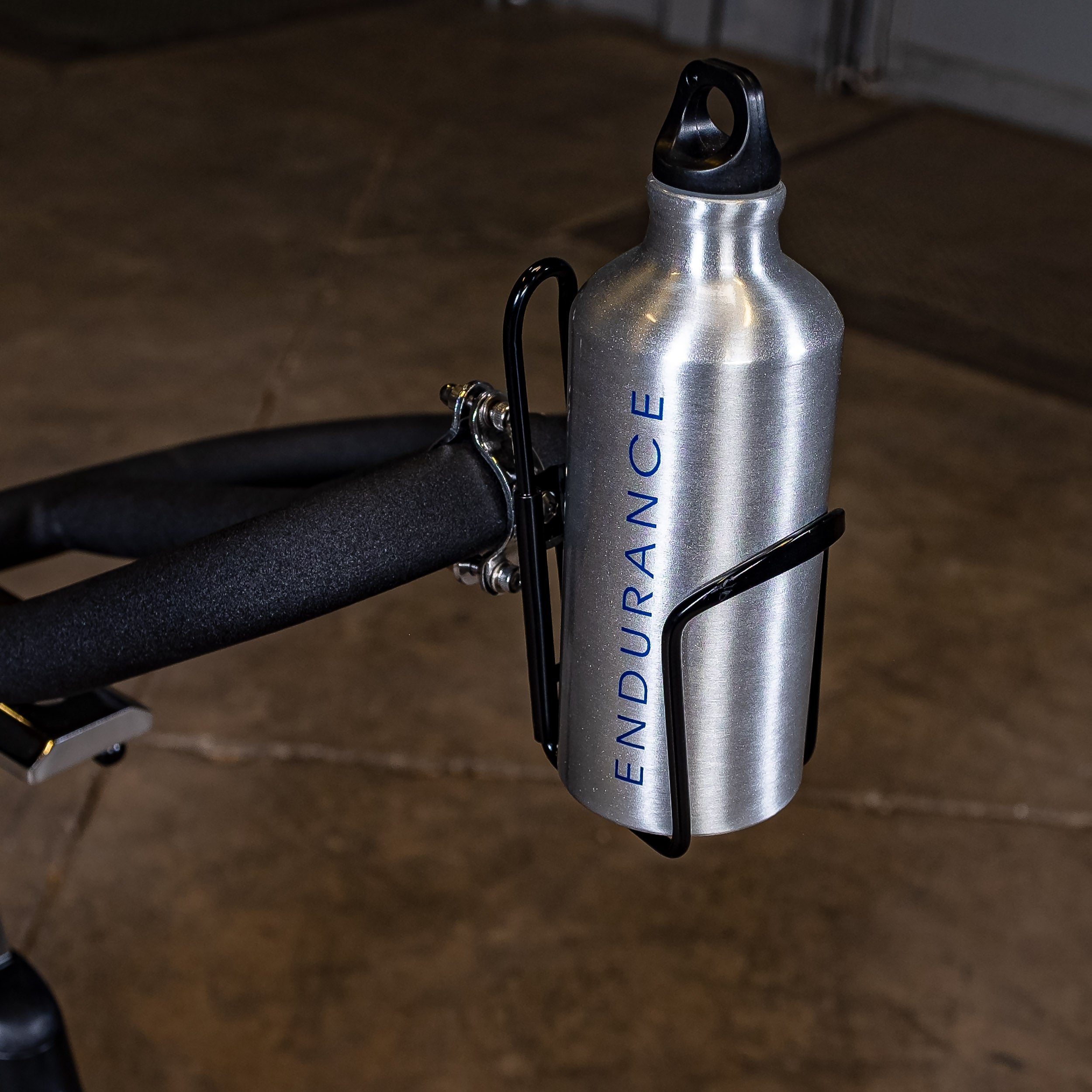 Close-up of the Body-Solid Endurance ESB250 indoor training cycle integrated water bottle holder with included water bottle