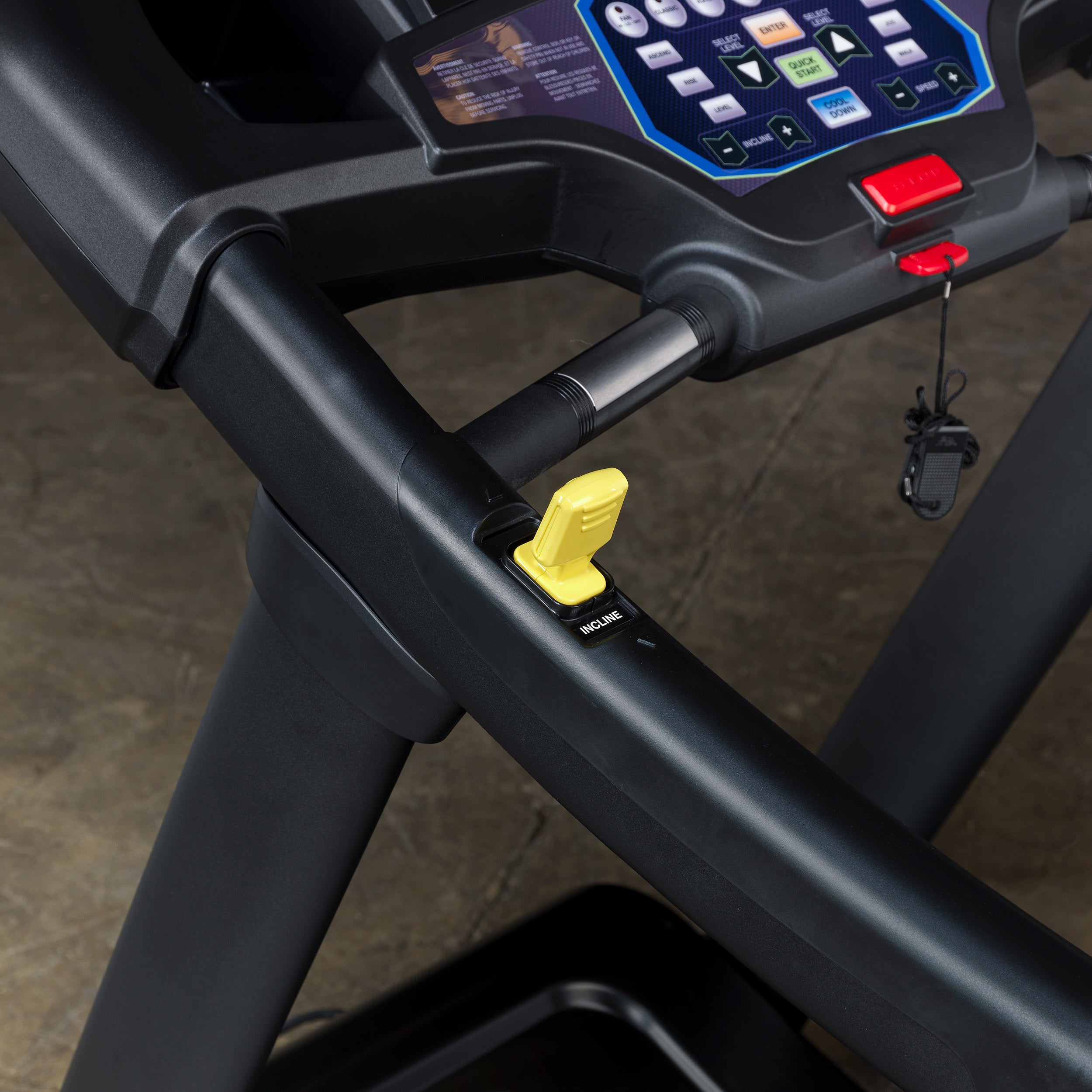 Close-up of Body-Solid Endurance T150 treadmill handle with incline control and safety key