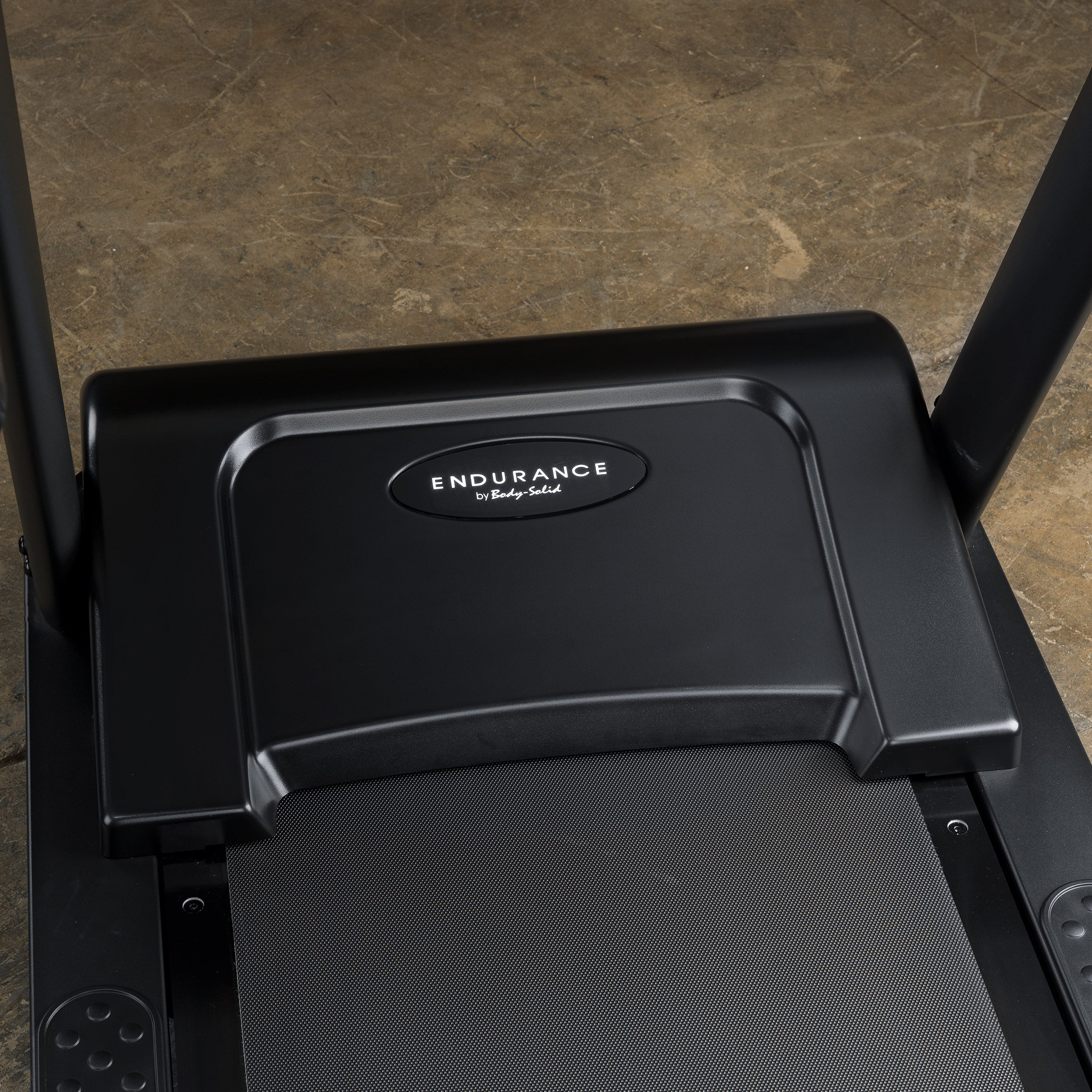 Close-up of Body-Solid Endurance T150 treadmill front motor cover with Endurance branding