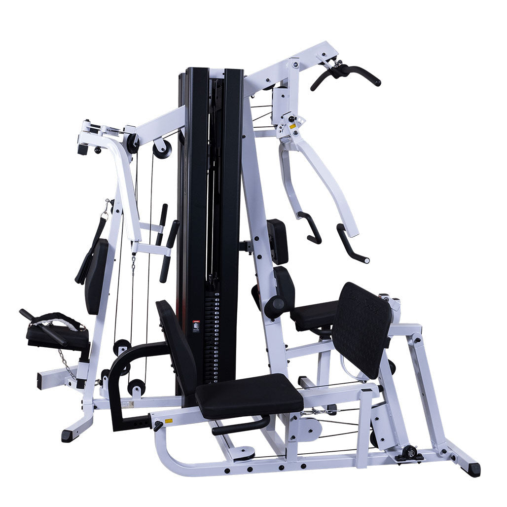Body-Solid EXM3000LPS dual stack multi-station gym featuring an integrated leg press, chest press, lat pulldown, pec fly, and seated row stations on a white background