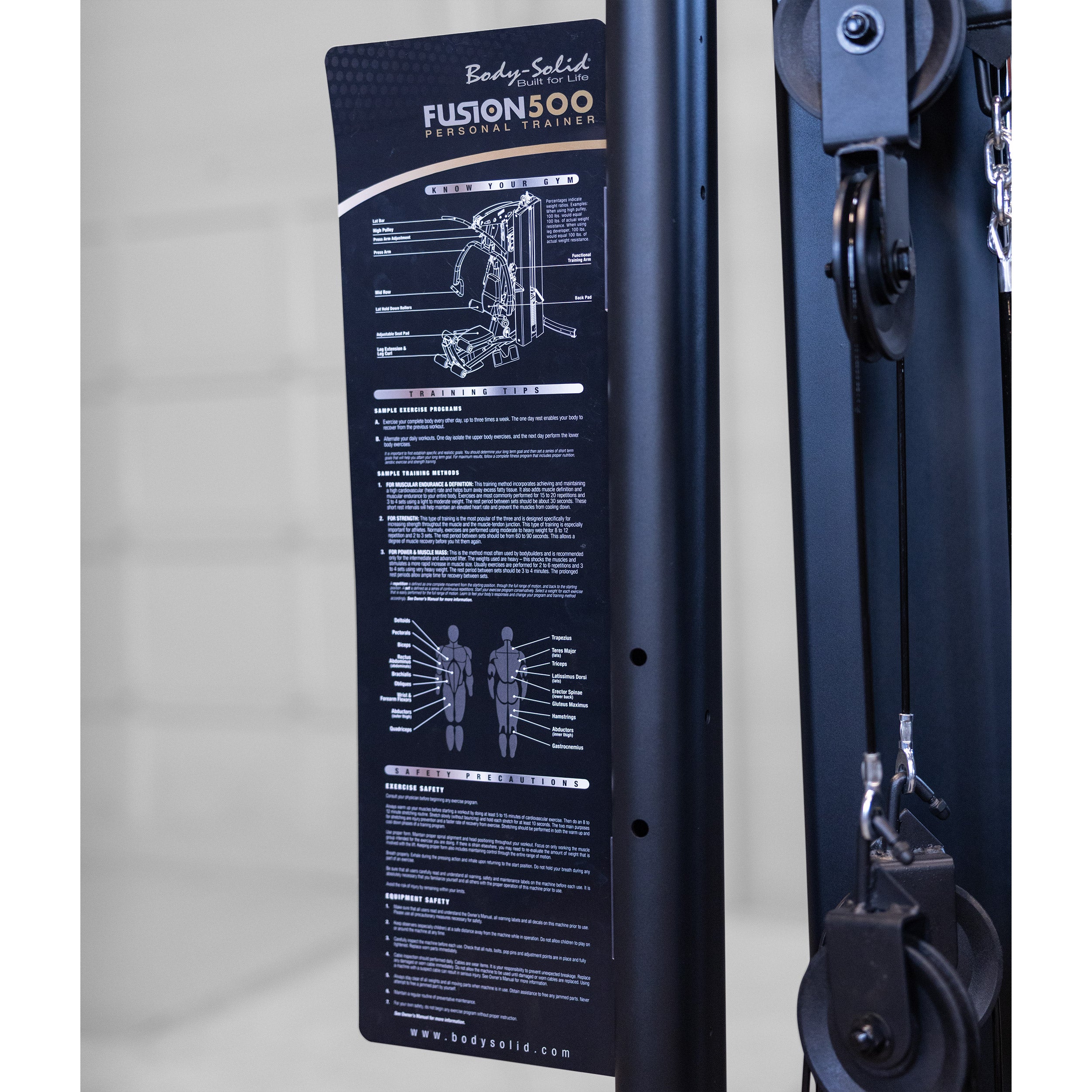 Close-up of the training guide on the Body-Solid Fusion 500B Personal Trainer showing exercise information muscle groups and safety guidelines