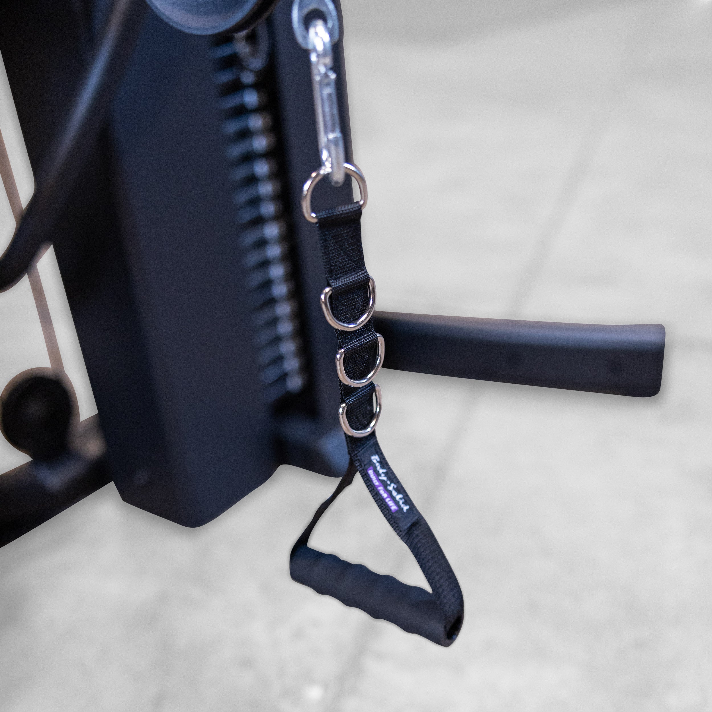 Close-up of the Body-Solid Fusion 600B functional training handle with adjustable strap attachment and cable connection