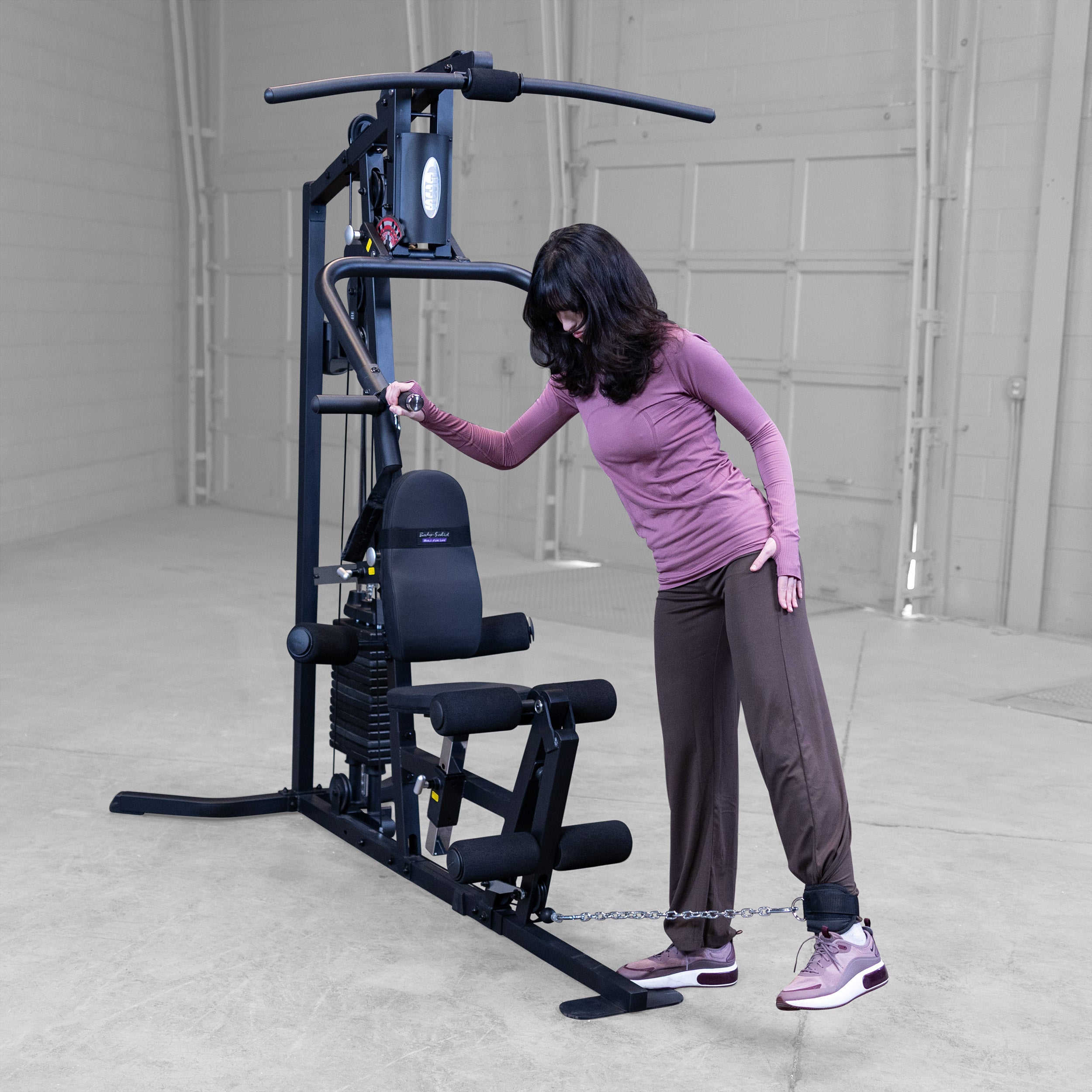 Person performing standing cable hip abductions on the Body-Solid G3B multi station home gym to strengthen the glutes and outer hips