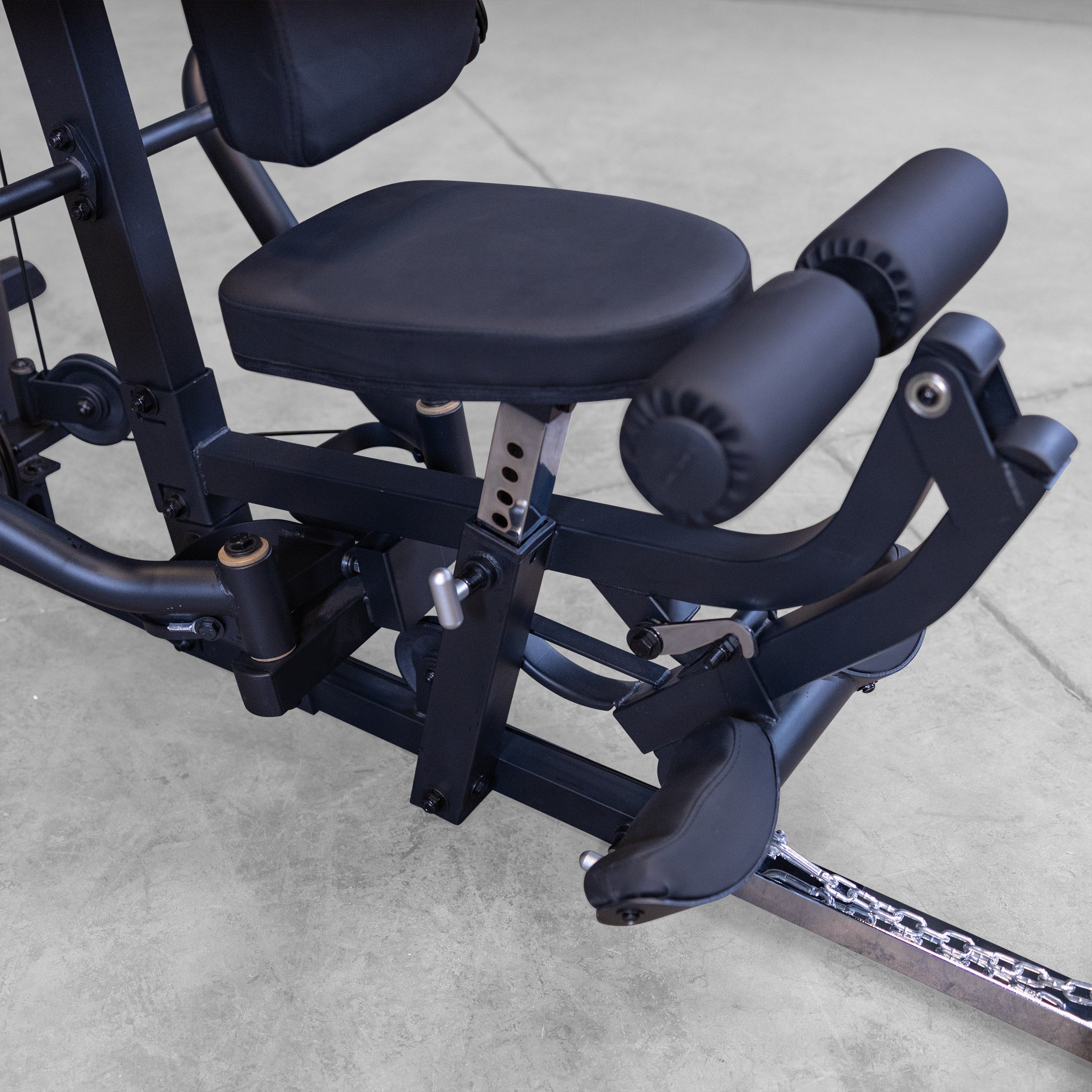 Close up of the adjustable leg developer and seat on the Body-Solid G5B multi station home gym for leg extensions and leg curls