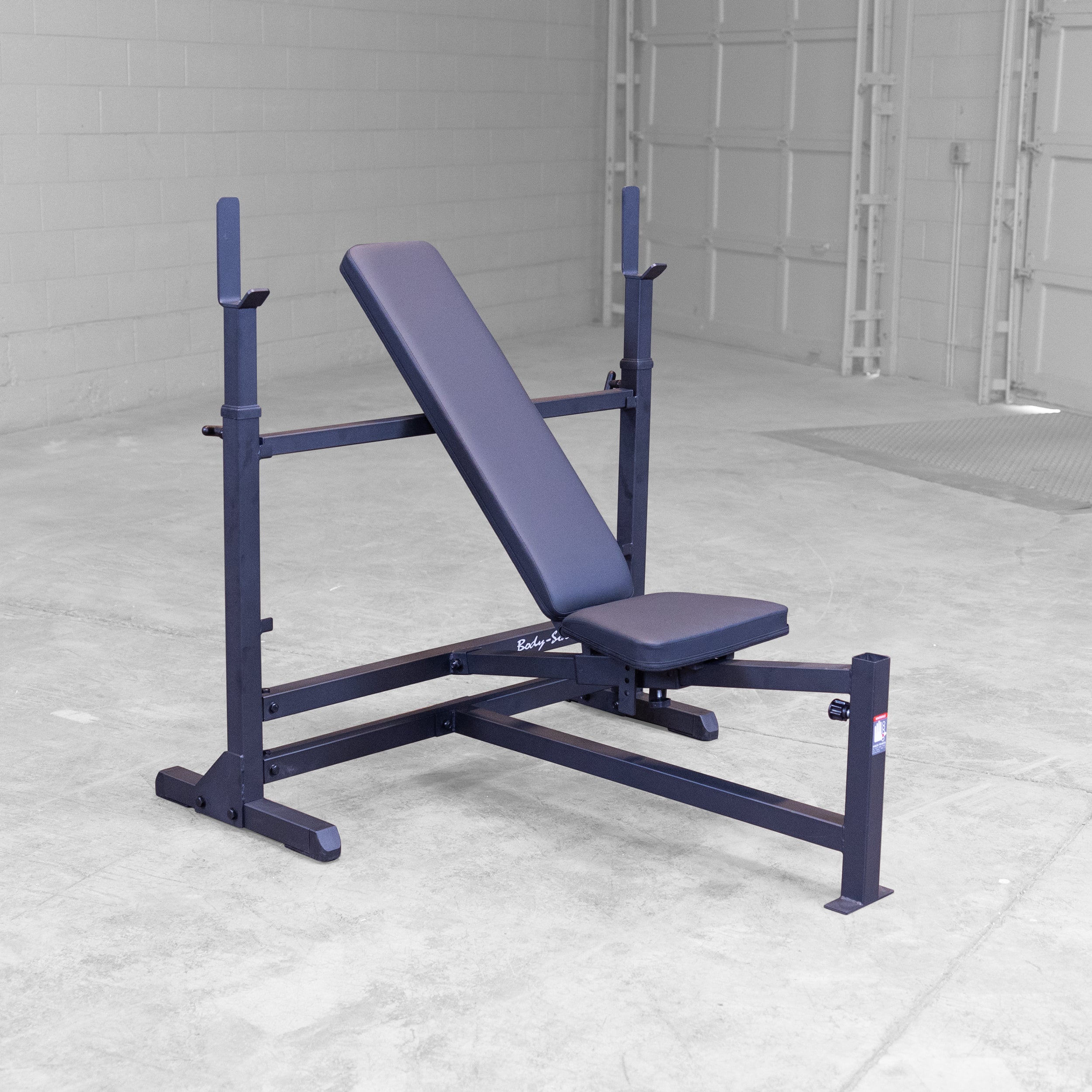 Body-Solid GDIB46LB PowerCenter Bench shown in an incline position with adjustable barbell uprights