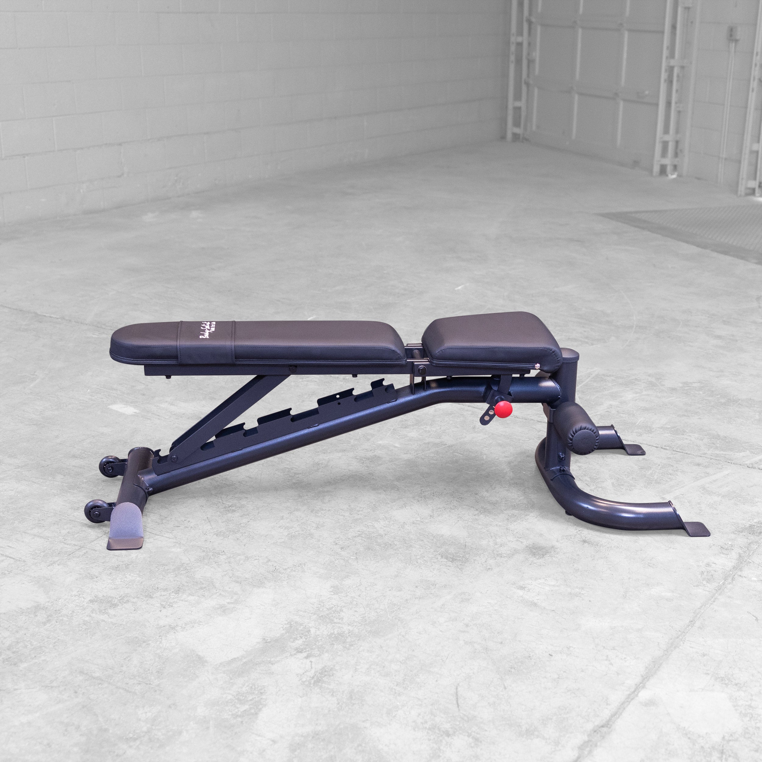 Body Solid GFID100B adjustable weight bench shown in flat position for home gym strength training