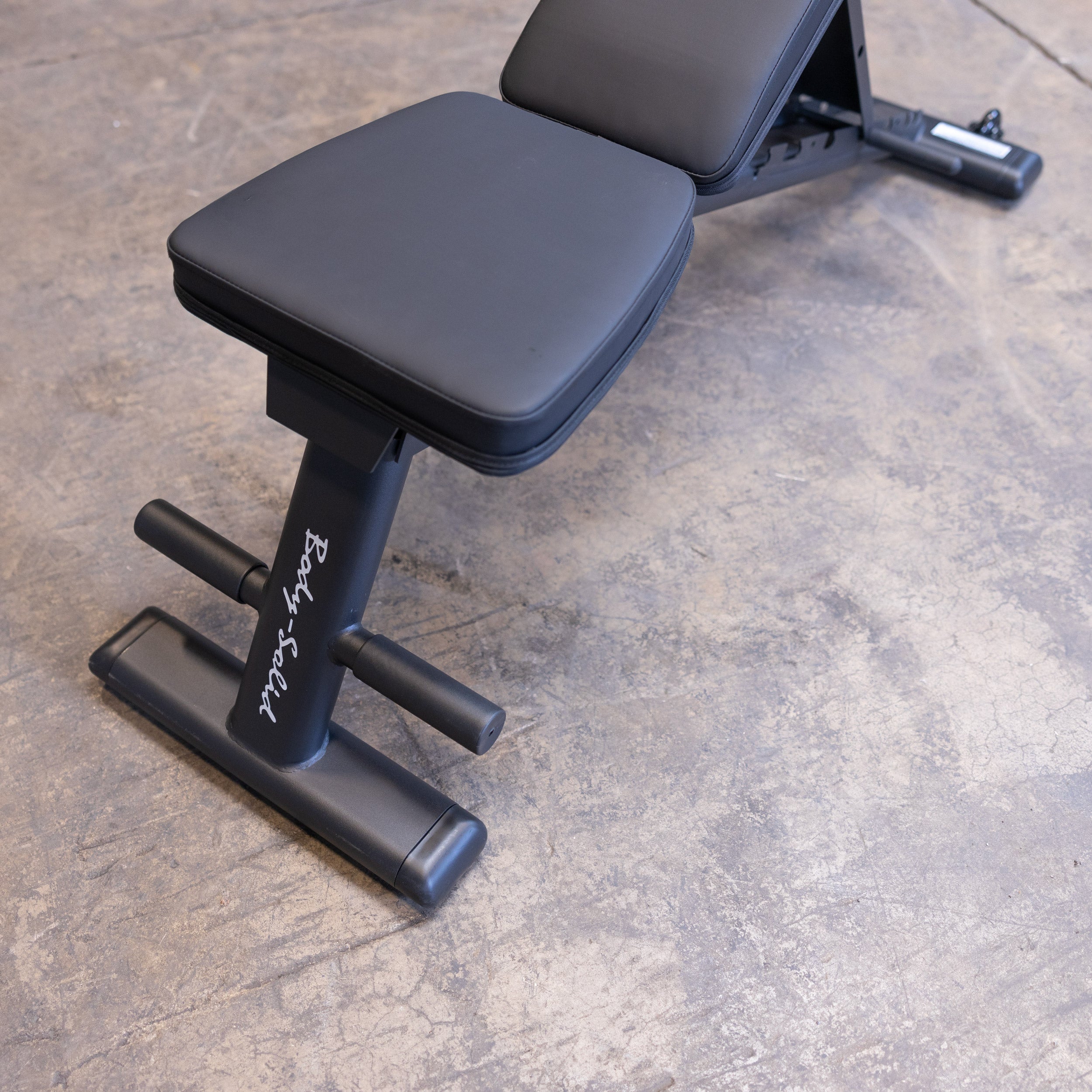 Close up of the Body Solid GFID225B folding adjustable weight bench seat pad with high density cushioning for comfort and support
