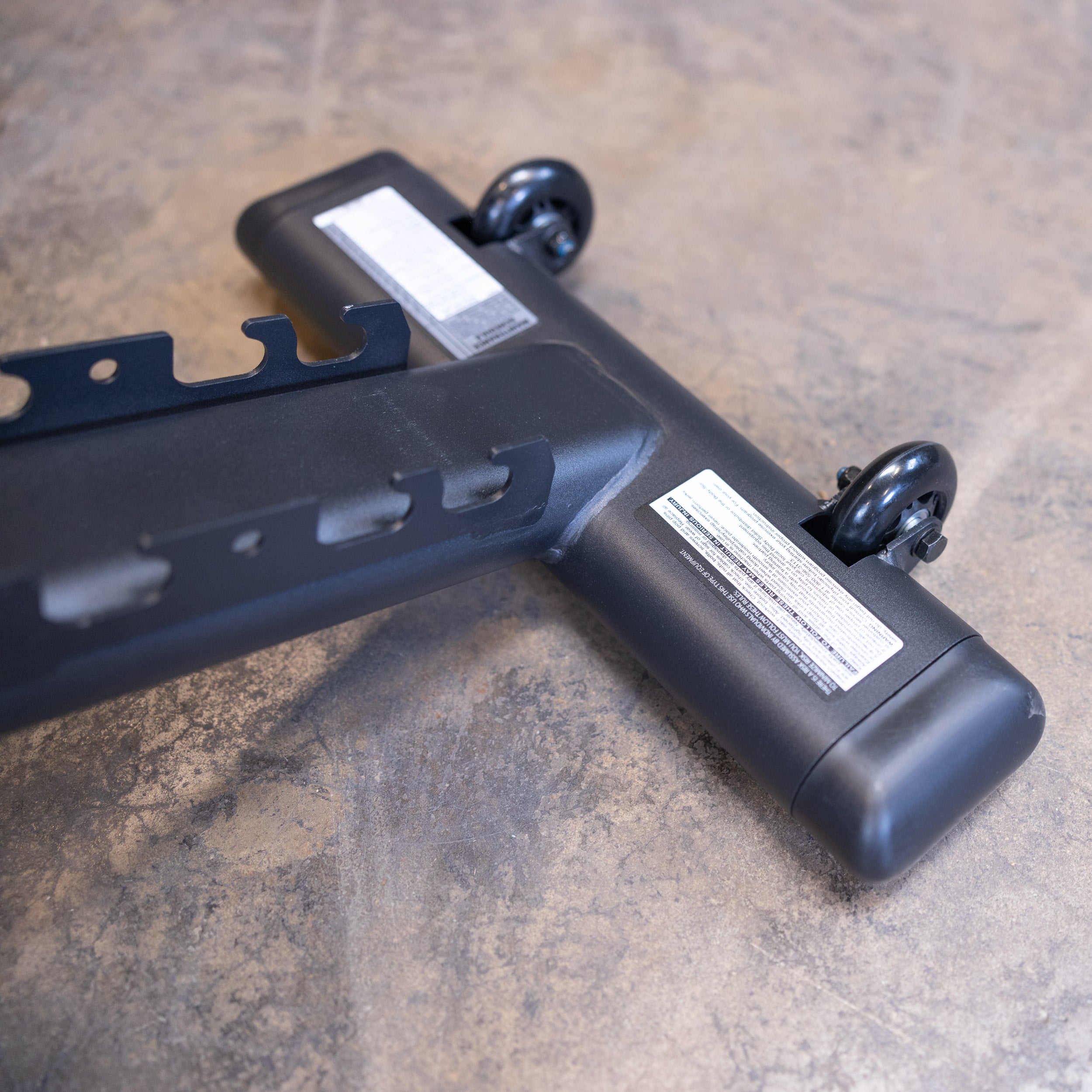 Close up of the Body Solid GFID225B transport wheels for easy movement and storage