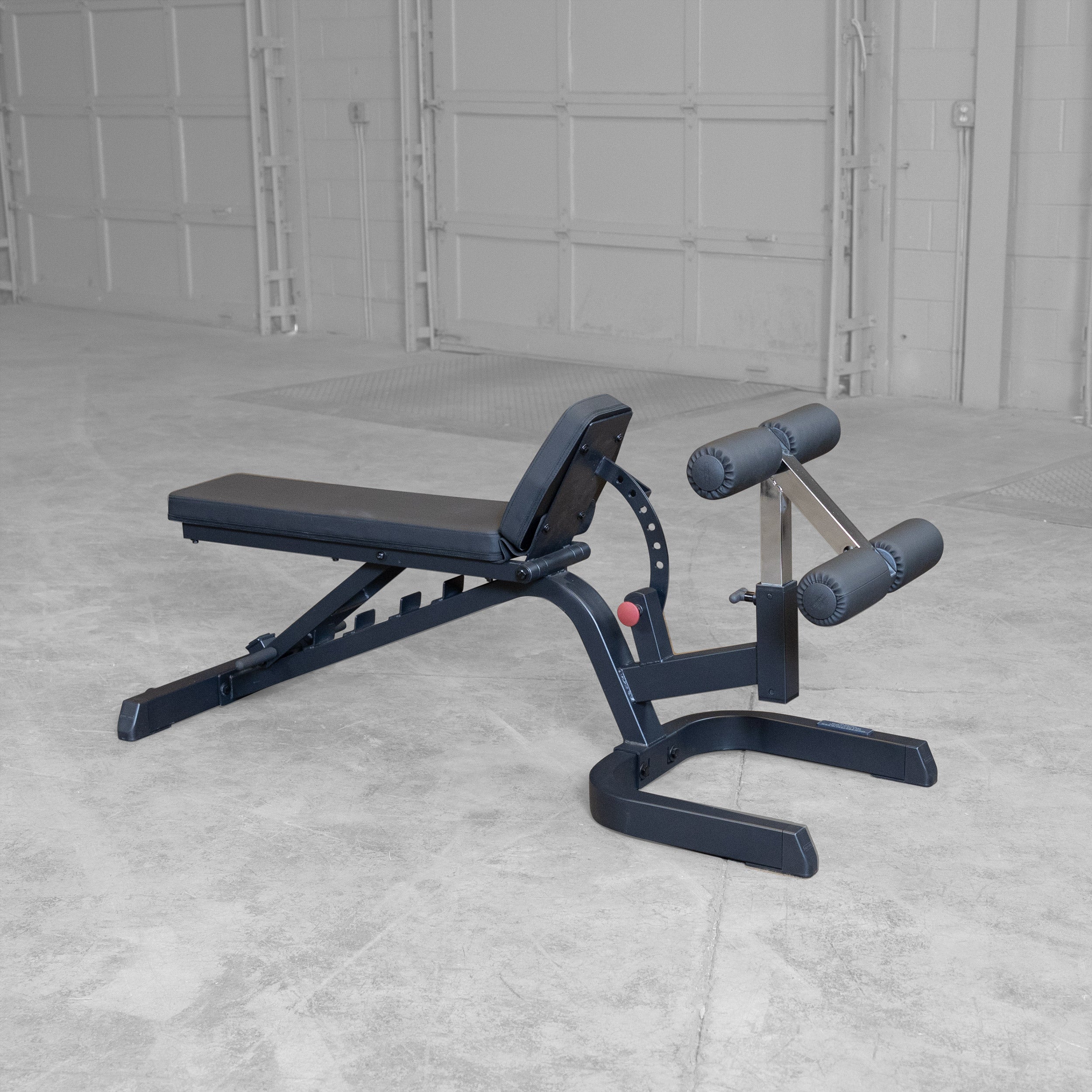 Body-Solid GFID71B Heavy Duty Flat Incline Decline Bench shown with the seat pad adjusted to a high incline position to provide secure support for steep incline and shoulder press exercises