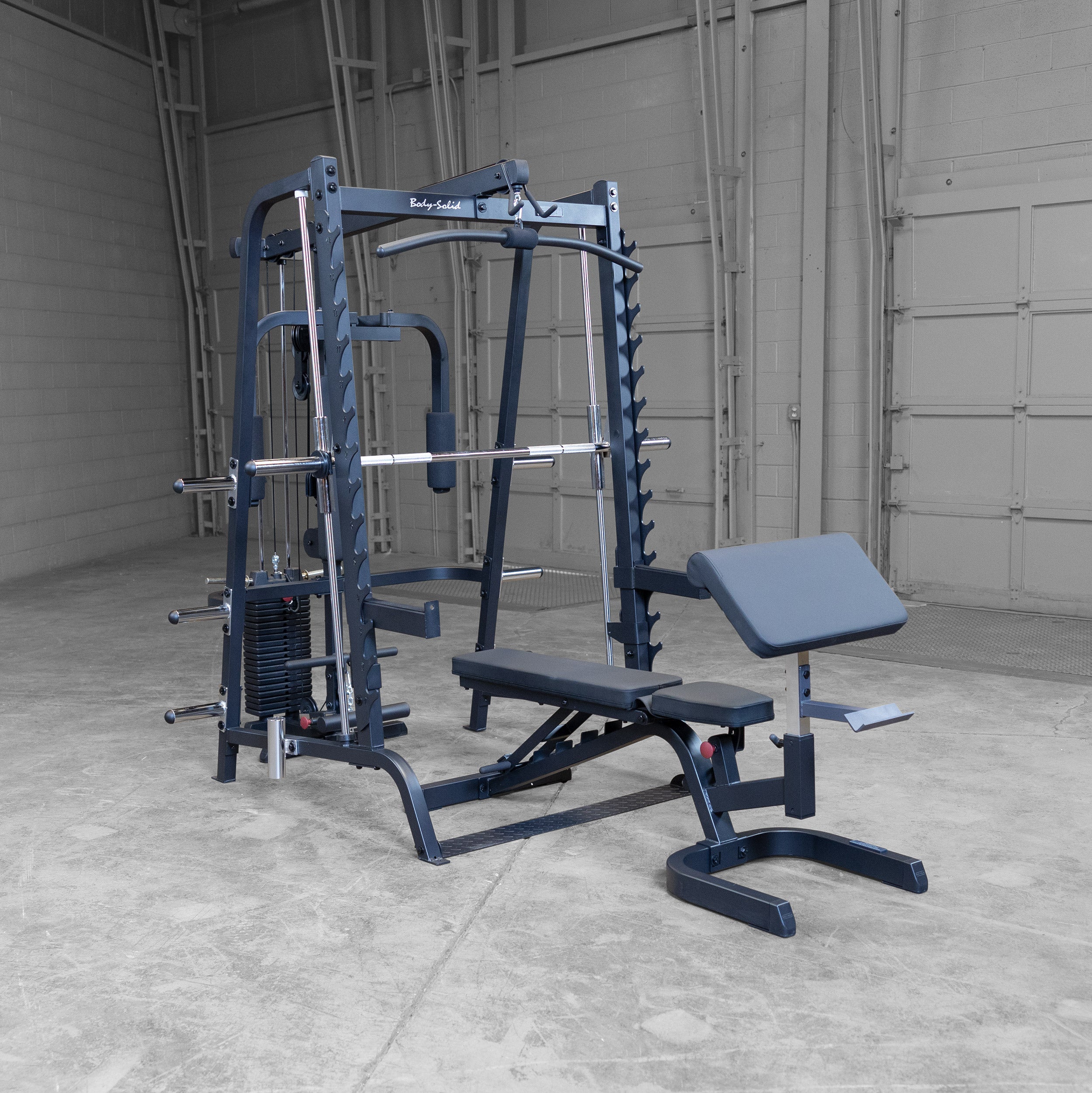 Body-Solid GS348BP4 Series 7 Smith Gym Package displayed in a gym setting featuring a Smith machine, lat attachment, pec station, adjustable bench, preacher curl attachment, and 210 lb weight stack
