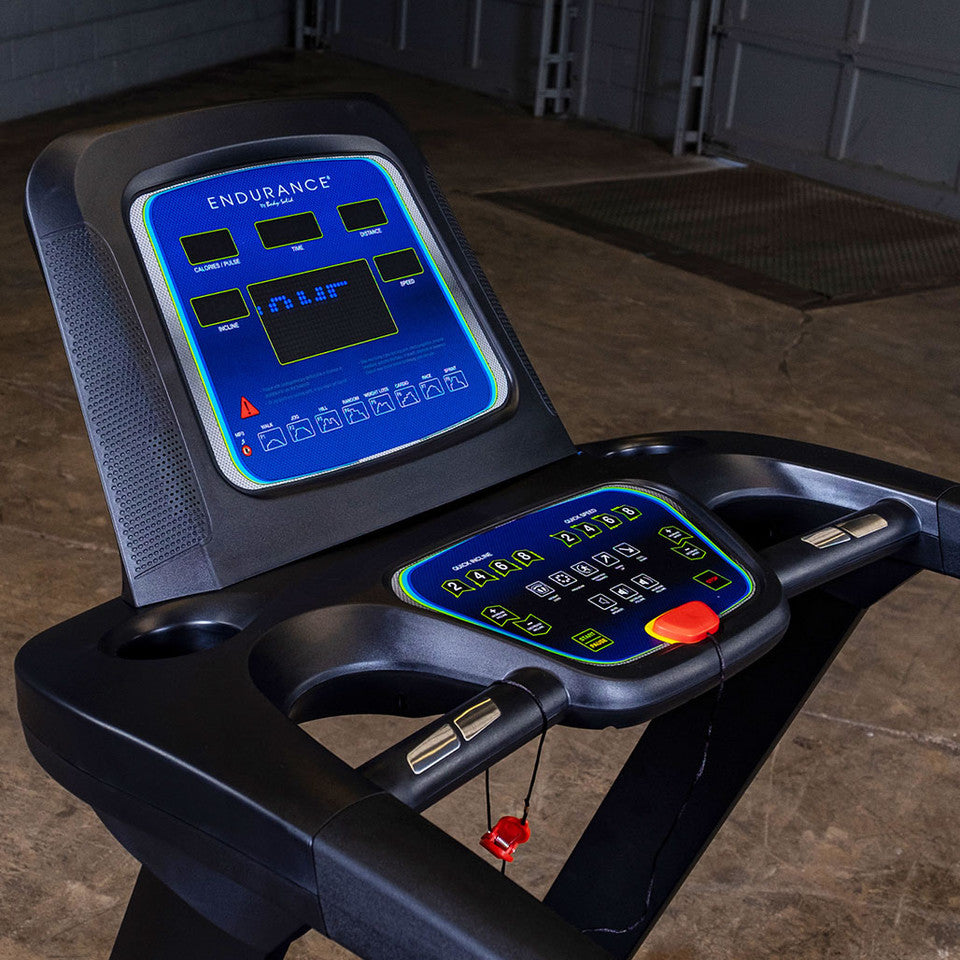 Close-up of Body-Solid Endurance T25 treadmill LED console with controls, display, and safety key