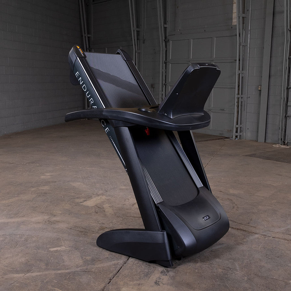 Body-Solid Endurance T25 treadmill folded upright from rear angle showing compact storage design