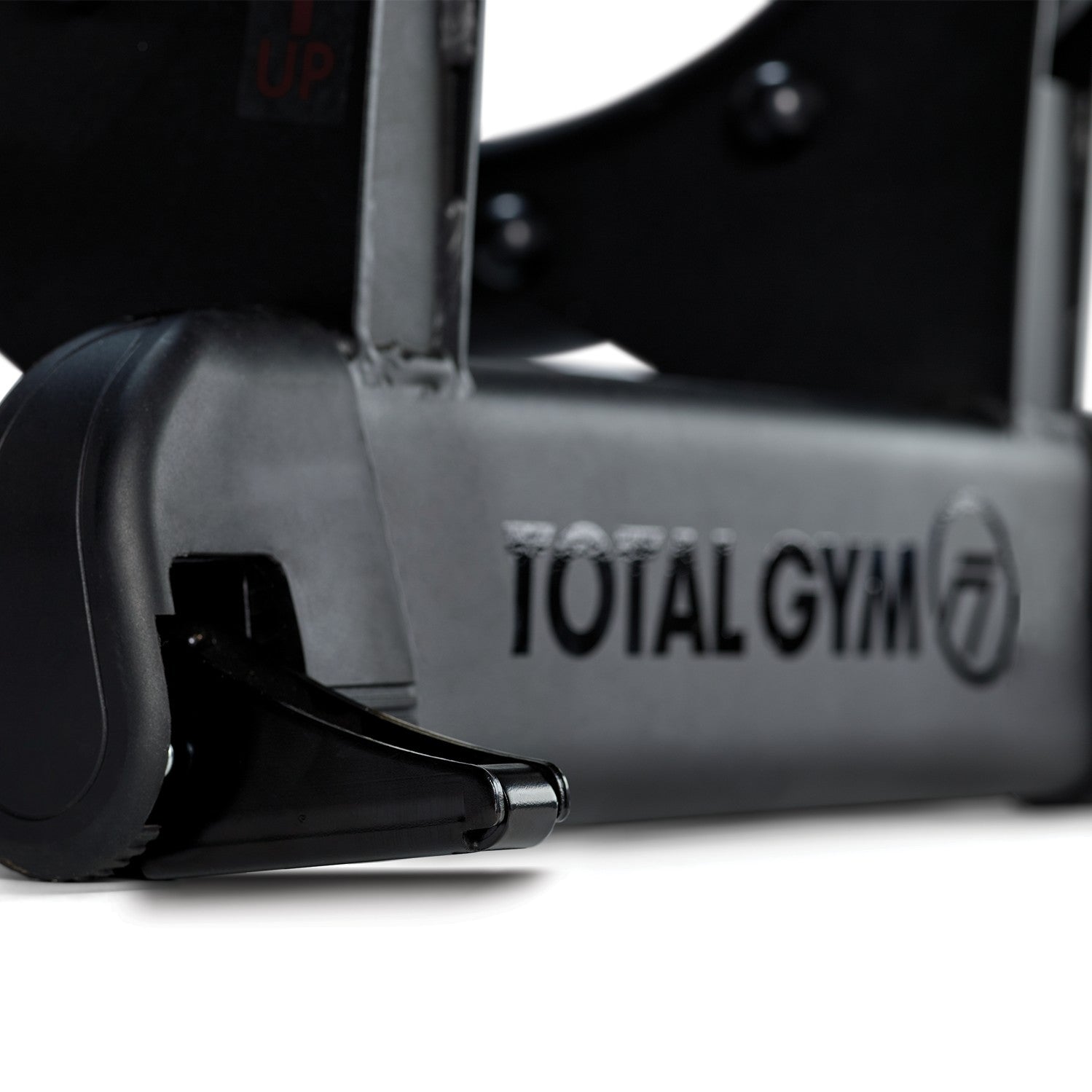 Close-up of the Total Gym ELEVATE Jump floor anchor and commercial-grade base construction