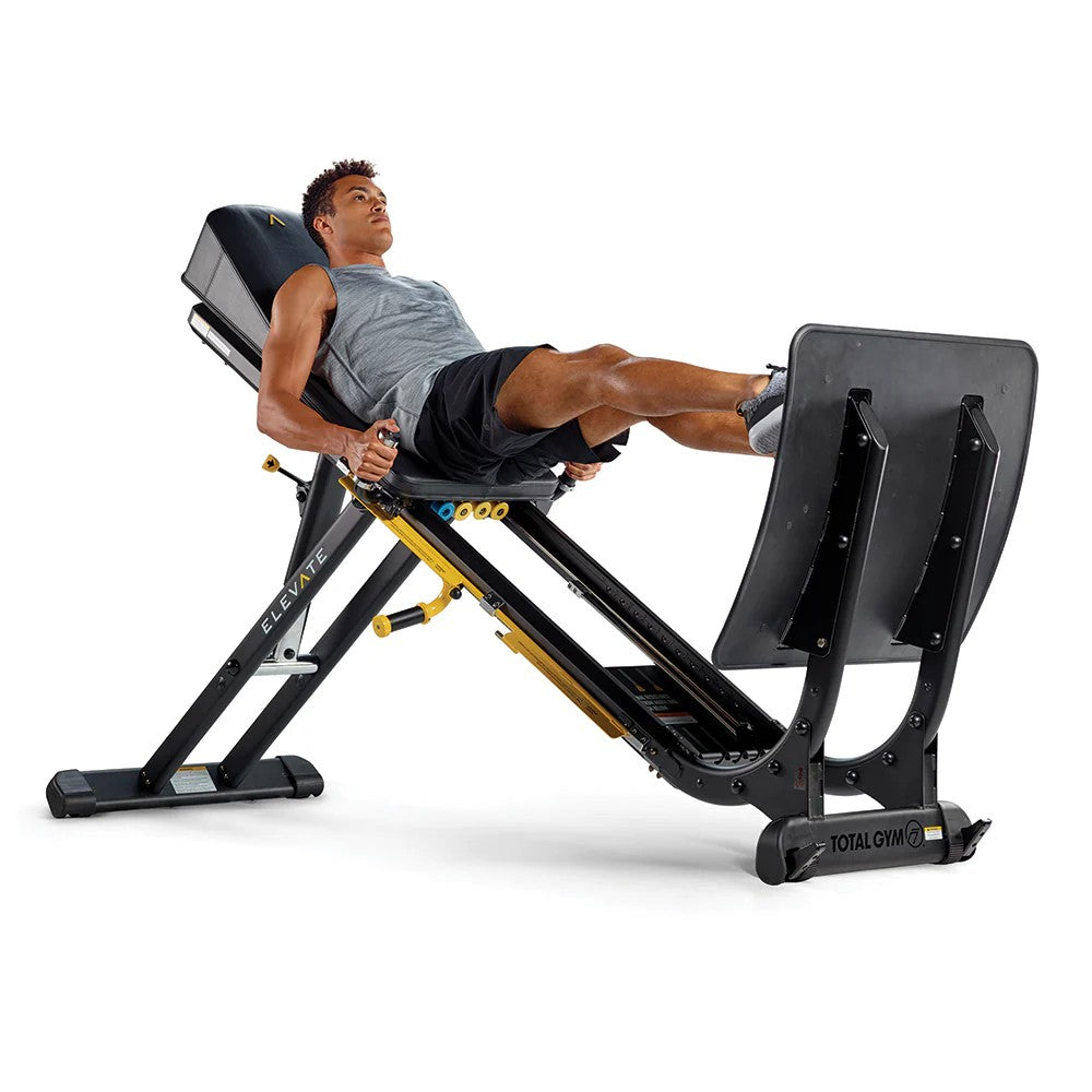Athlete performing a leg press exercise on the Total Gym ELEVATE Jump using adjustable bodyweight resistance